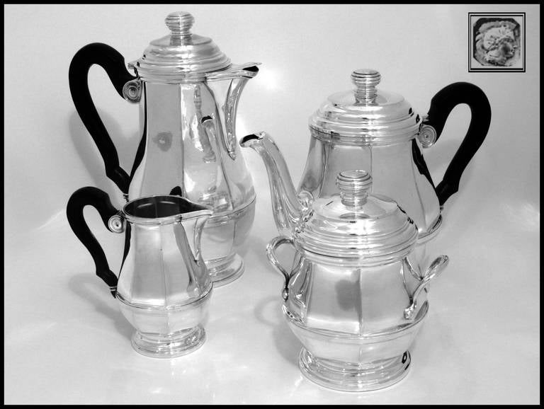 TETARD Fabulous French All Sterling Silver Tea & Coffee Service 4 pc

Head of Minerve 1 st titre for 950/1000 French Sterling Silver guarantee 

A rare sterling silver tea and coffee service 4 pc with rosewood handles. The set includes a Coffee