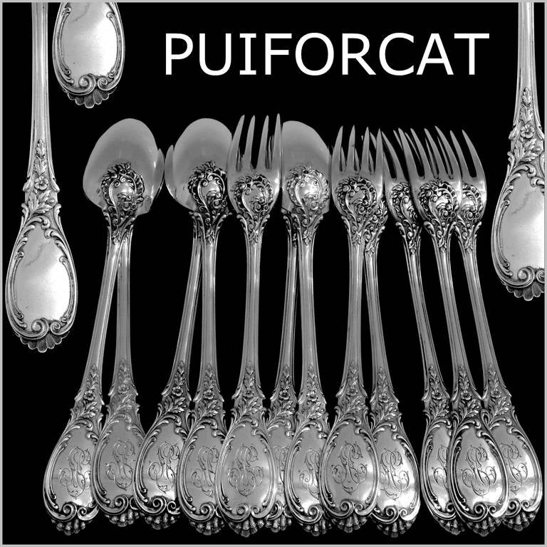 PUIFORCAT French Sterling Silver Dinner Flatware Set 12 pc Roses

Head of Minerve 1 st titre for 950/1000 French Sterling Silver guarantee

Handles have Rococo decoration with a sophisticated foliage decoration. This model is called 
