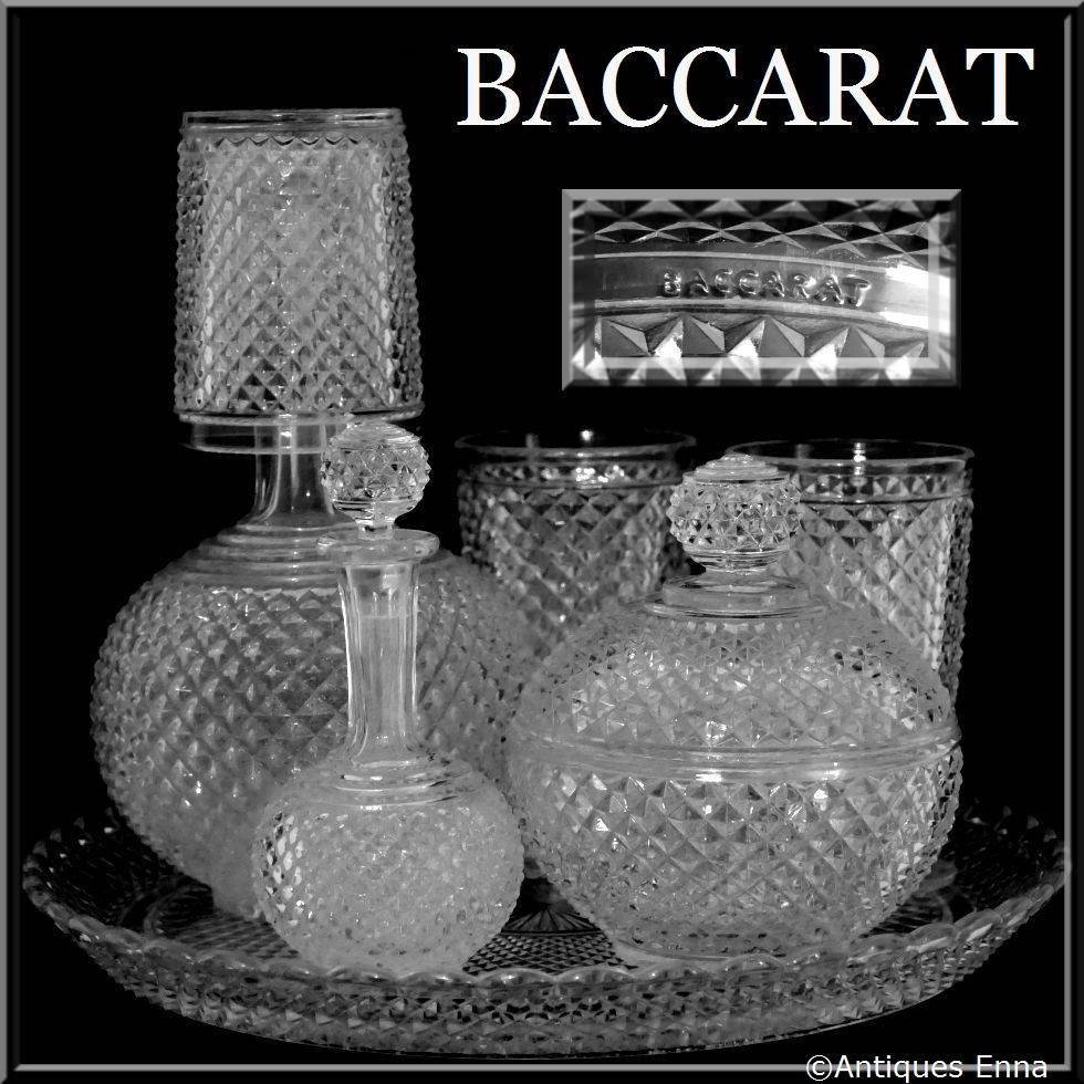 1900 Rare Baccarat Diamond Cut Crystal Water or Night Set 7 pc

Baccarat crystal Night Set with diamond-point motifs comprising circular platter with laced border, two footed glasses, a glass, a covered sugar, a carafe and a water decanter.