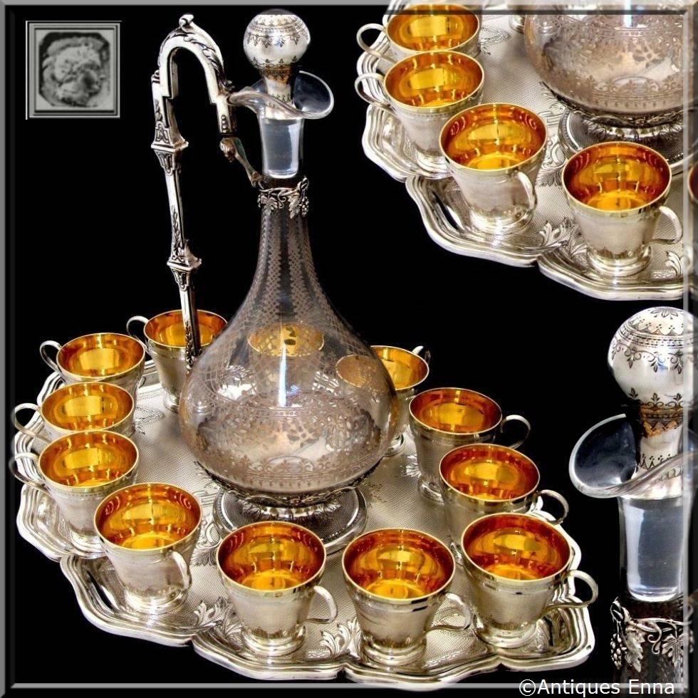 Boivin Rare French Sterling Silver Vermeil Baccarat Crystal Liquor Service 14 pc

This complete service includes twelve sterling silver vermeil cups with handles, a sterling silver and engraved crystal decanter and this original sterling silver