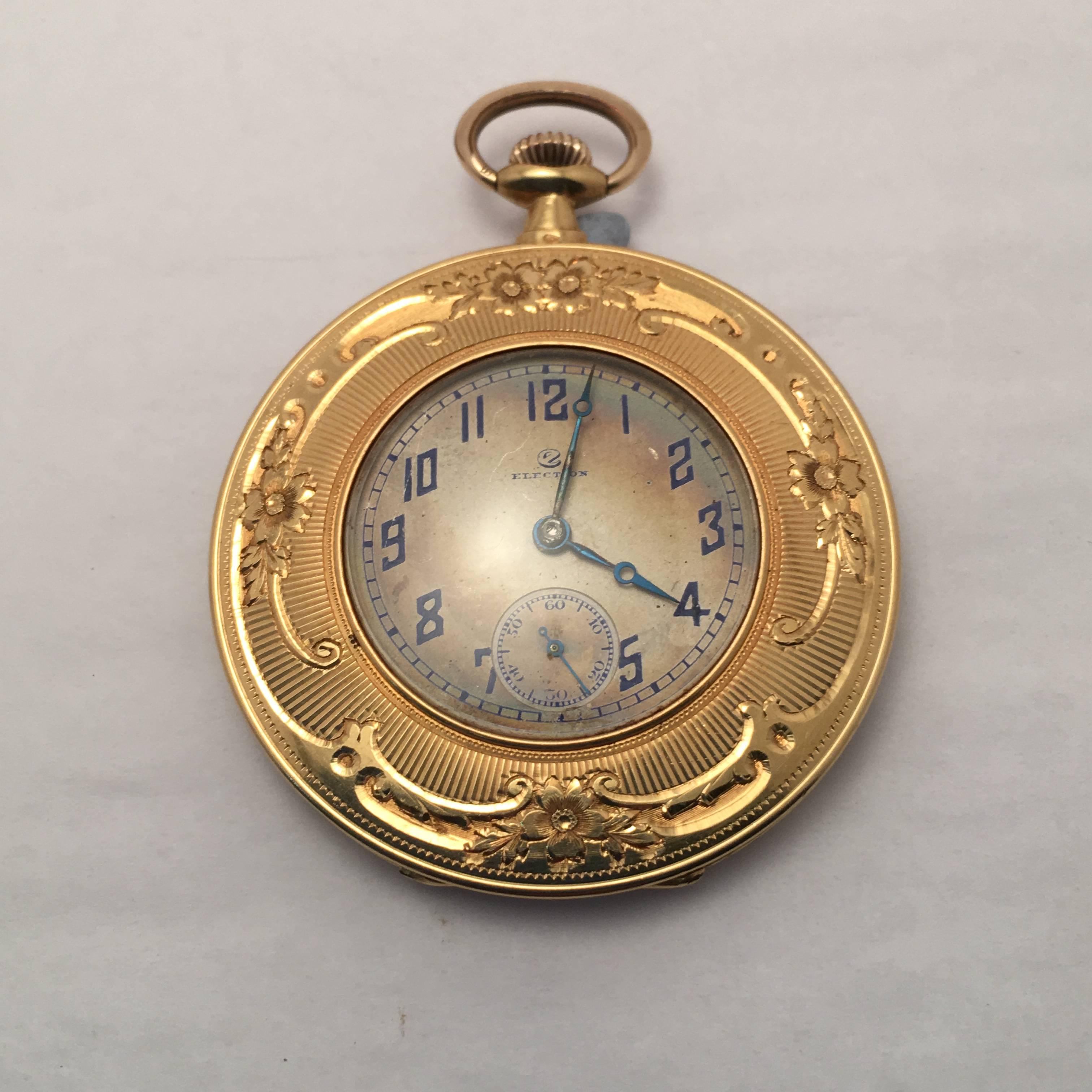 18 Kt. yellow gold Election pocket watch enameled on one side with horse and woman.  Enameling is embellished with gold flower motif.  Face side is also framed with flower motif and has separate minute dial.  The inside of the case is engraved