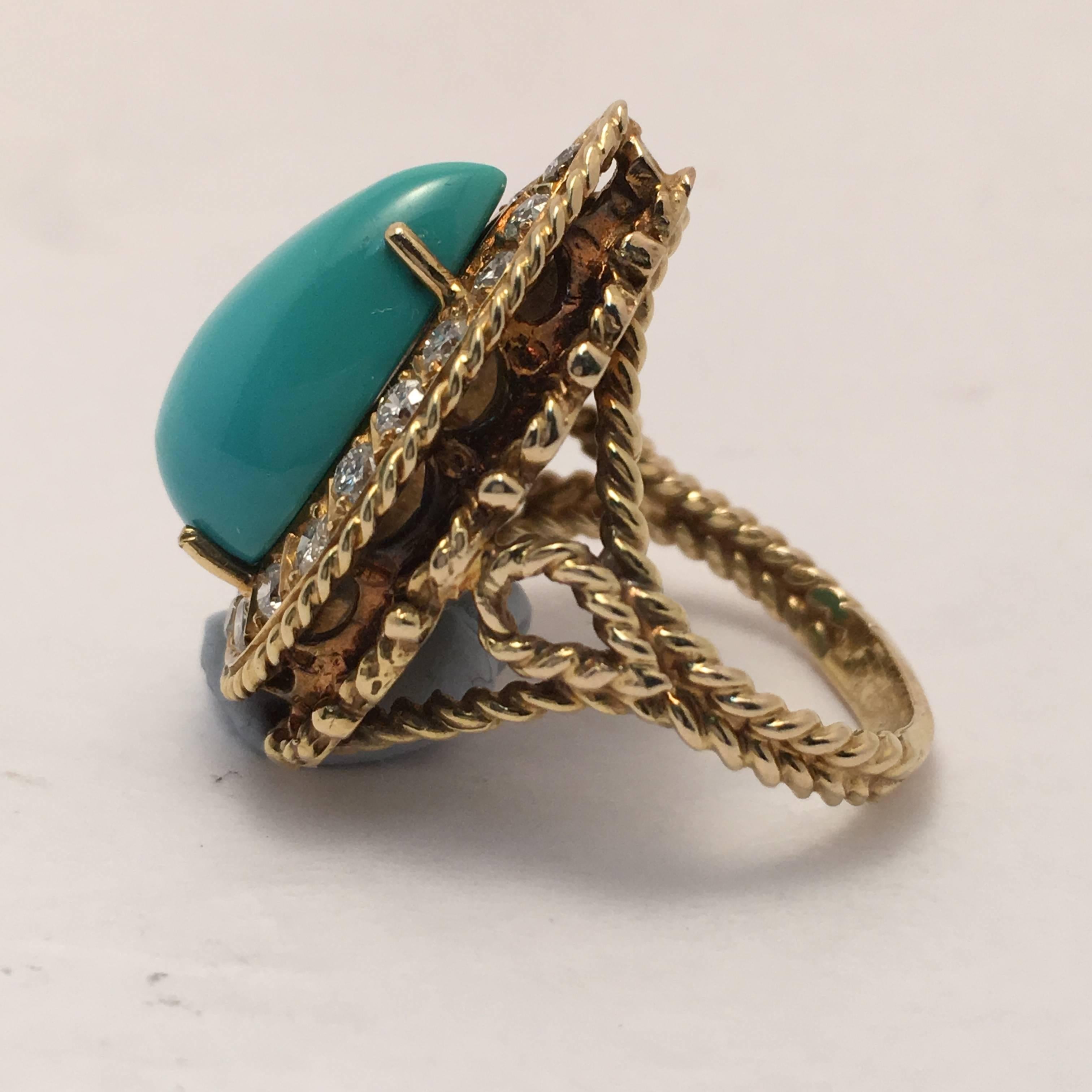 This 14 Kt. yellow gold ring is set with one pear shape Persian  turquoise and 19  full cut  diamonds weighing approximately .65 ct. total weight.  The mounting is of rope design and can be easily sized for any finger.  