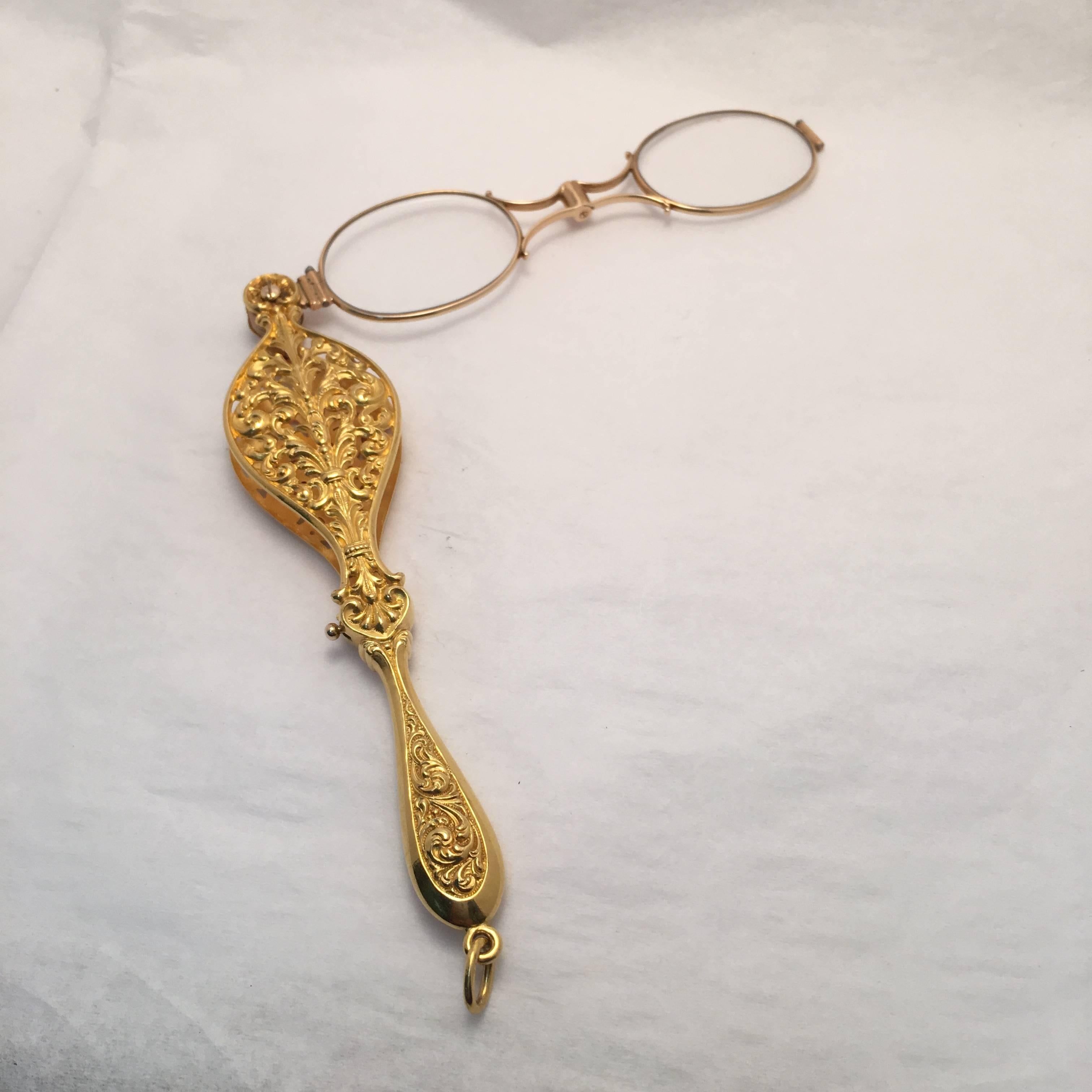 This 18 Kt. yellow gold finely crafted piece houses a pair of spectacles.  A wonderful conversation piece or unique pendant.   
