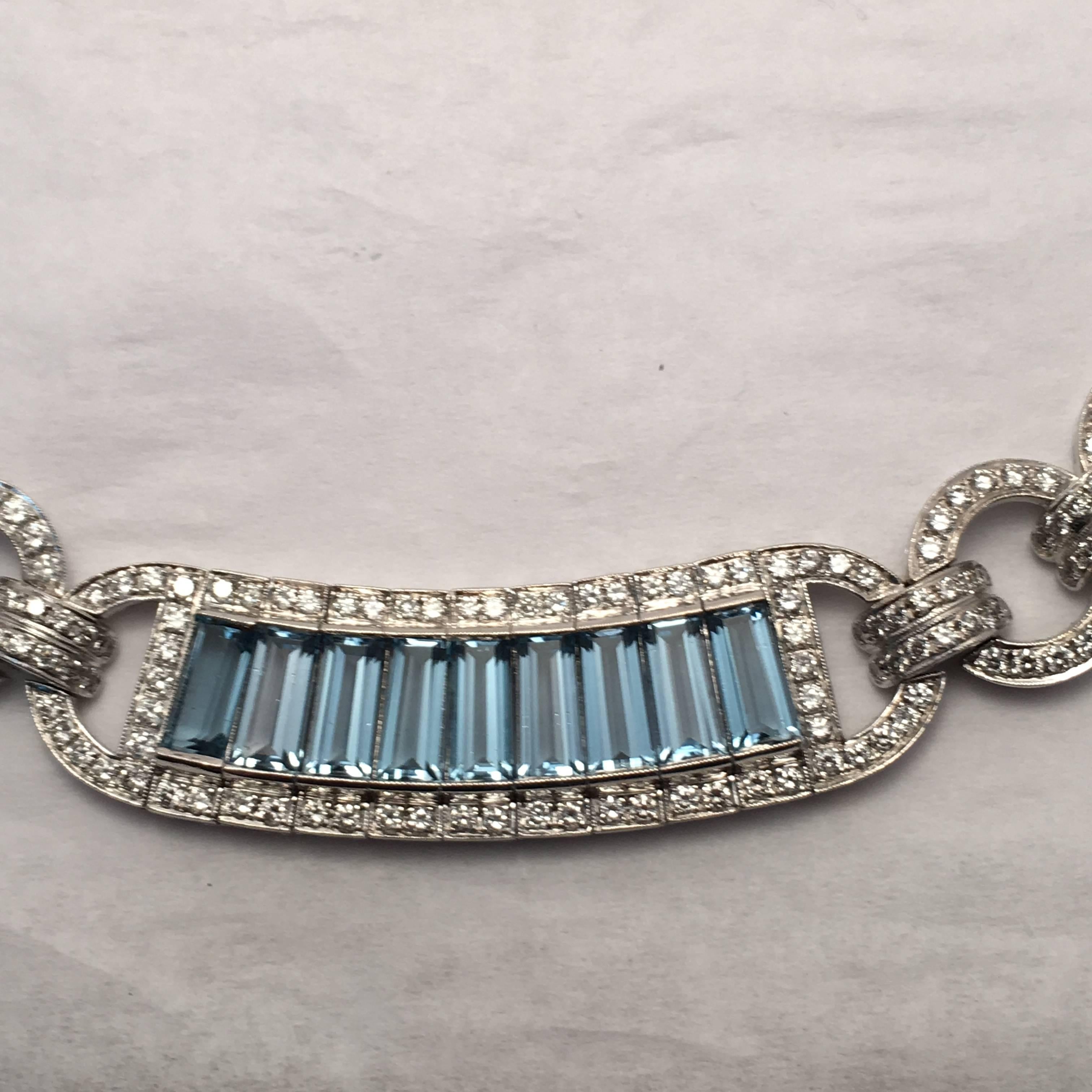 This 18 Kt. white gold necklace consists of 6 sections set with 54 emerald cut blue topaz weighing approximately 49.10 ct. total weight.  Surrounding the blue topaz is a row of round  diamonds around each section numbering 588 and weighing