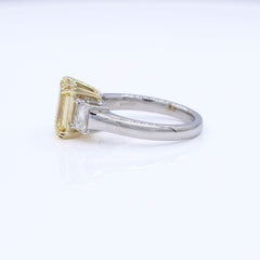 3.40 Carat Total Weight GIA Fancy Vivid Yellow Emerald Cut Three Stone Ring