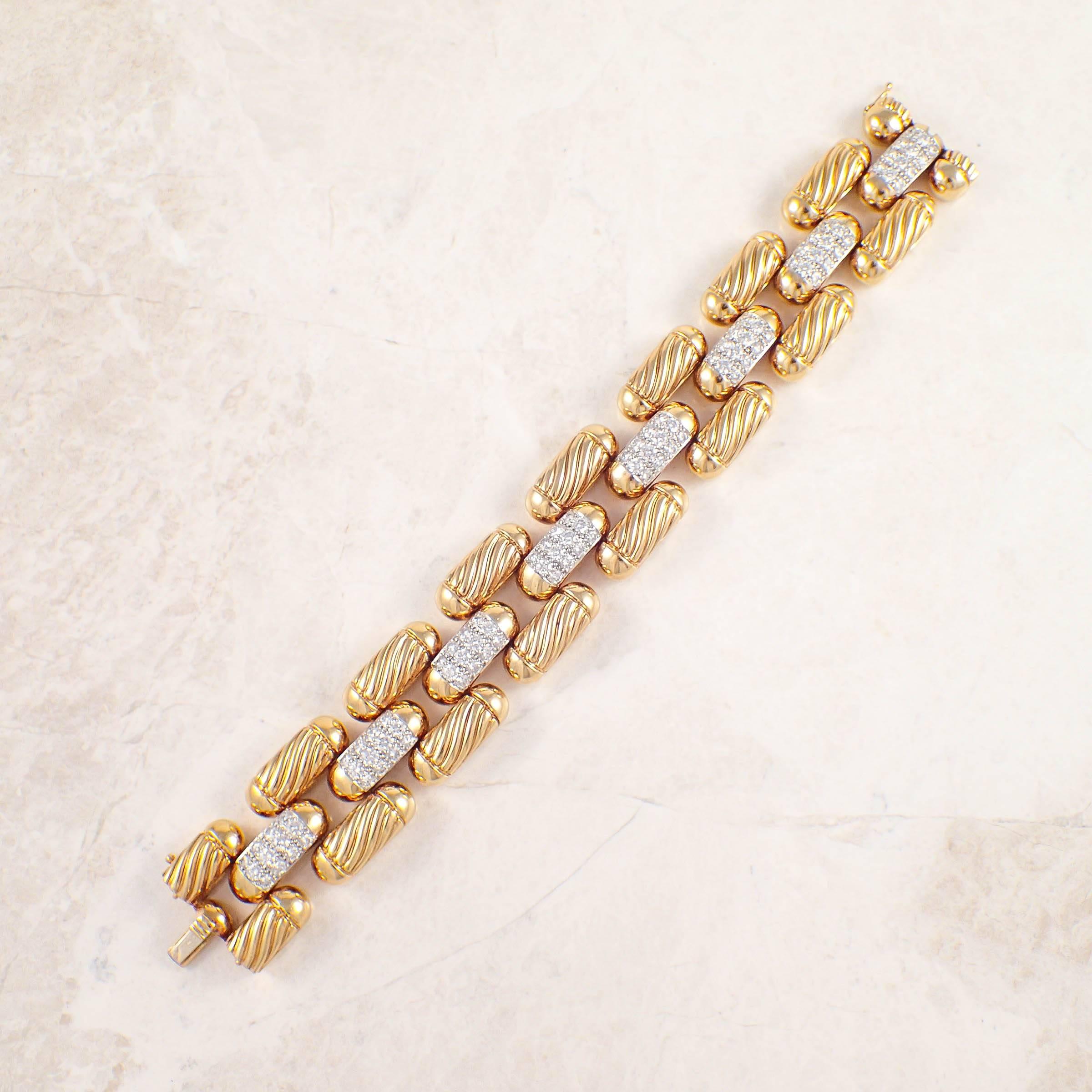 18K Yellow gold diamond bracelet. The panther style links each measure 1 inch wide, and are set with 96 round diamonds weighing approximately 6.75 carats total. The bracelet measures 7 1/2 inches long and weighs 73.2 DWTs/ 113.8 grams.  

Color: