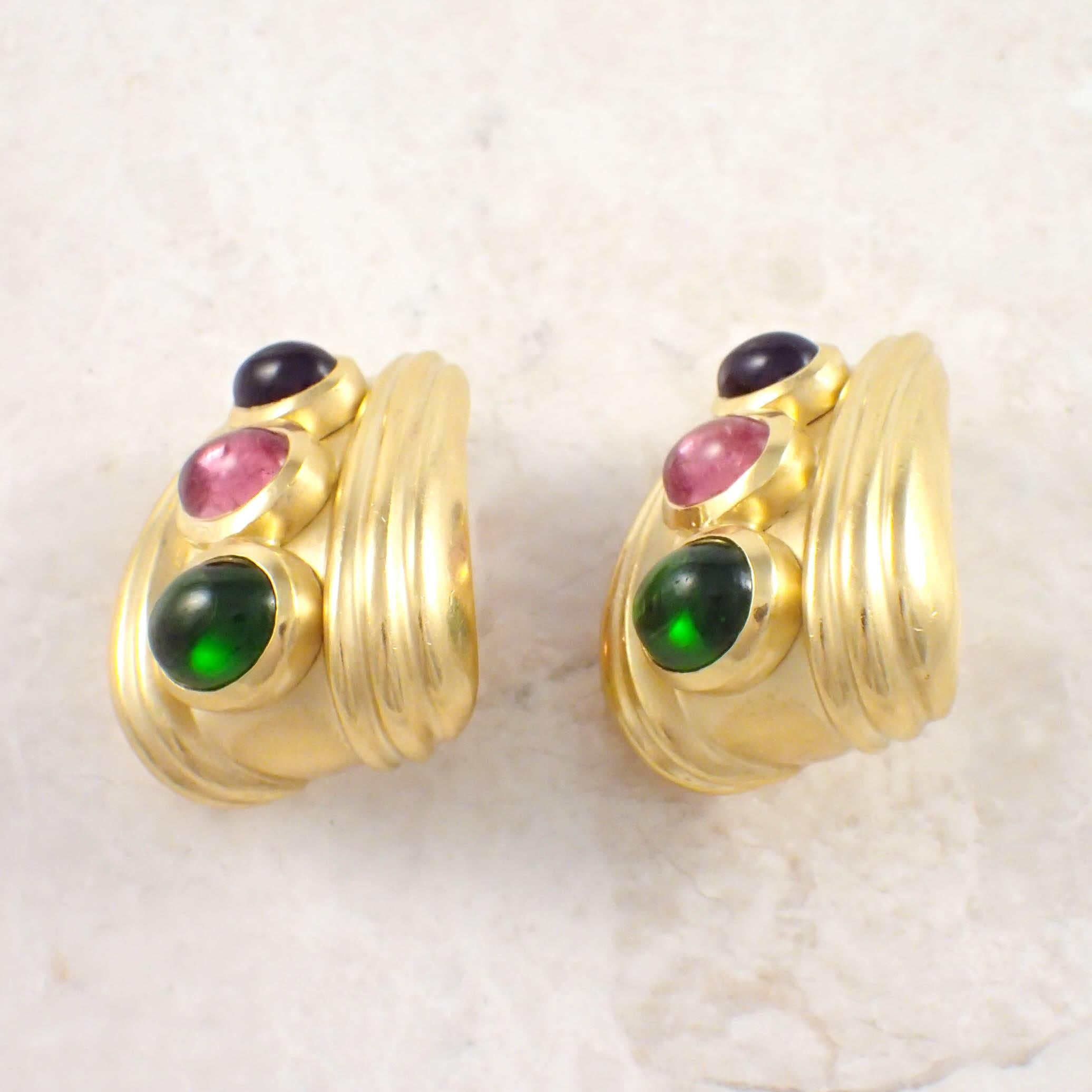 18K Yellow gold Seidengang multicolor stone earrings. The wide fluted earrings are set with oval cabochon cut green and pink tourmaline and amethysts. The earrings measure 2.3 X 26 mm. Gold weight 21.2 DWTs/ 32.9 grams. Stamped 
