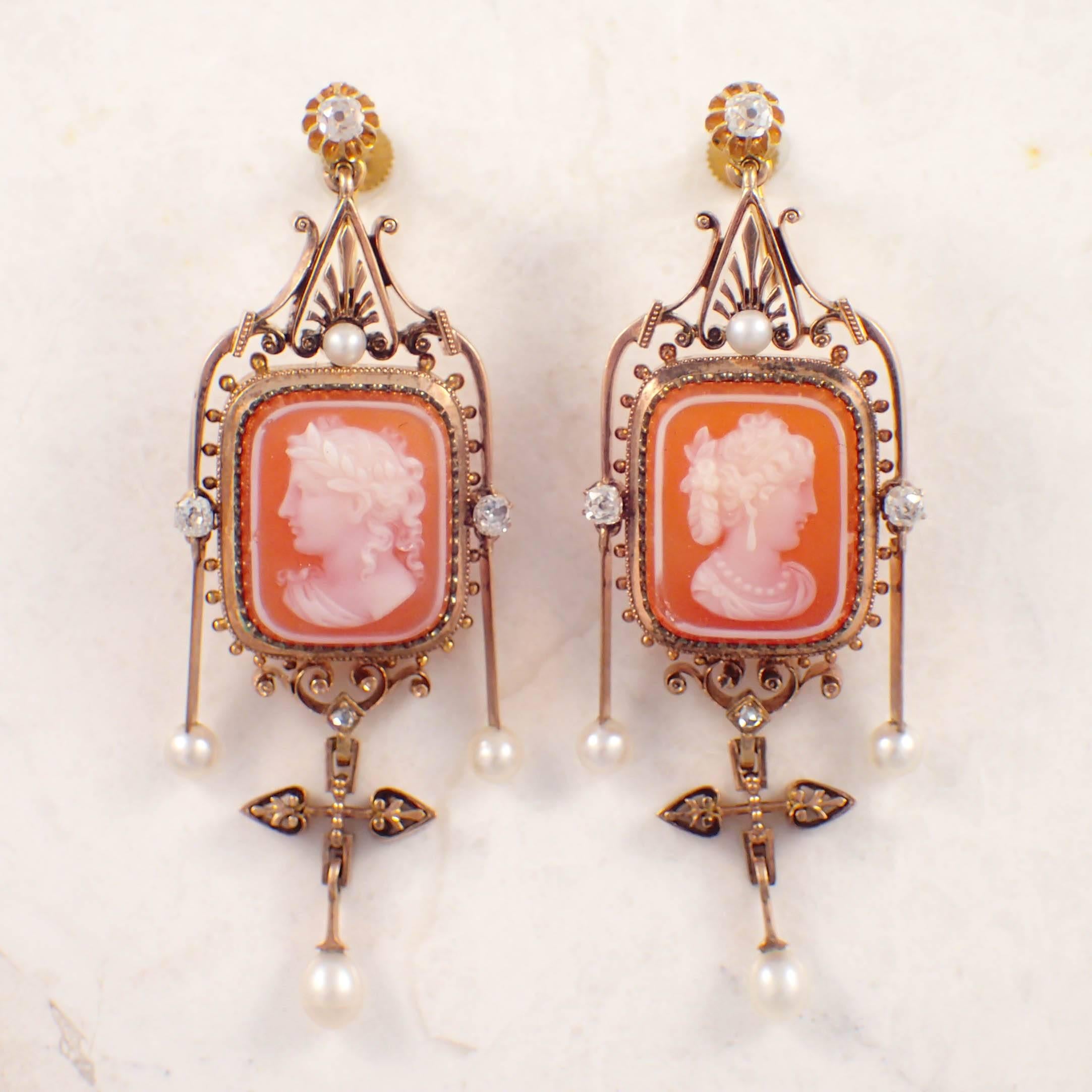 14K Yellow gold Victorian cameo brooch and earrings set. The rectangular carved carnelian depicts a young lady. The fancy frame of the pendant brooch is decorated with scroll work and gold beads and is set with 7 pearls measuring 4.2 mm and two old