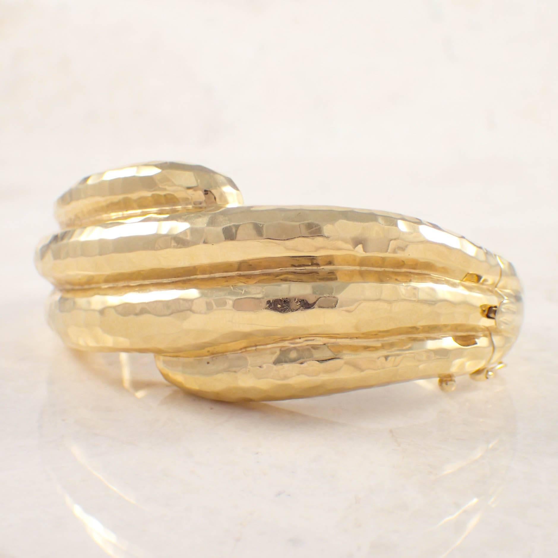 14K Yellow gold M. Rotkel bangle bracelet. The hammered style bangle measures 31 mm wide and weighs 78.4 grams. Stamped 