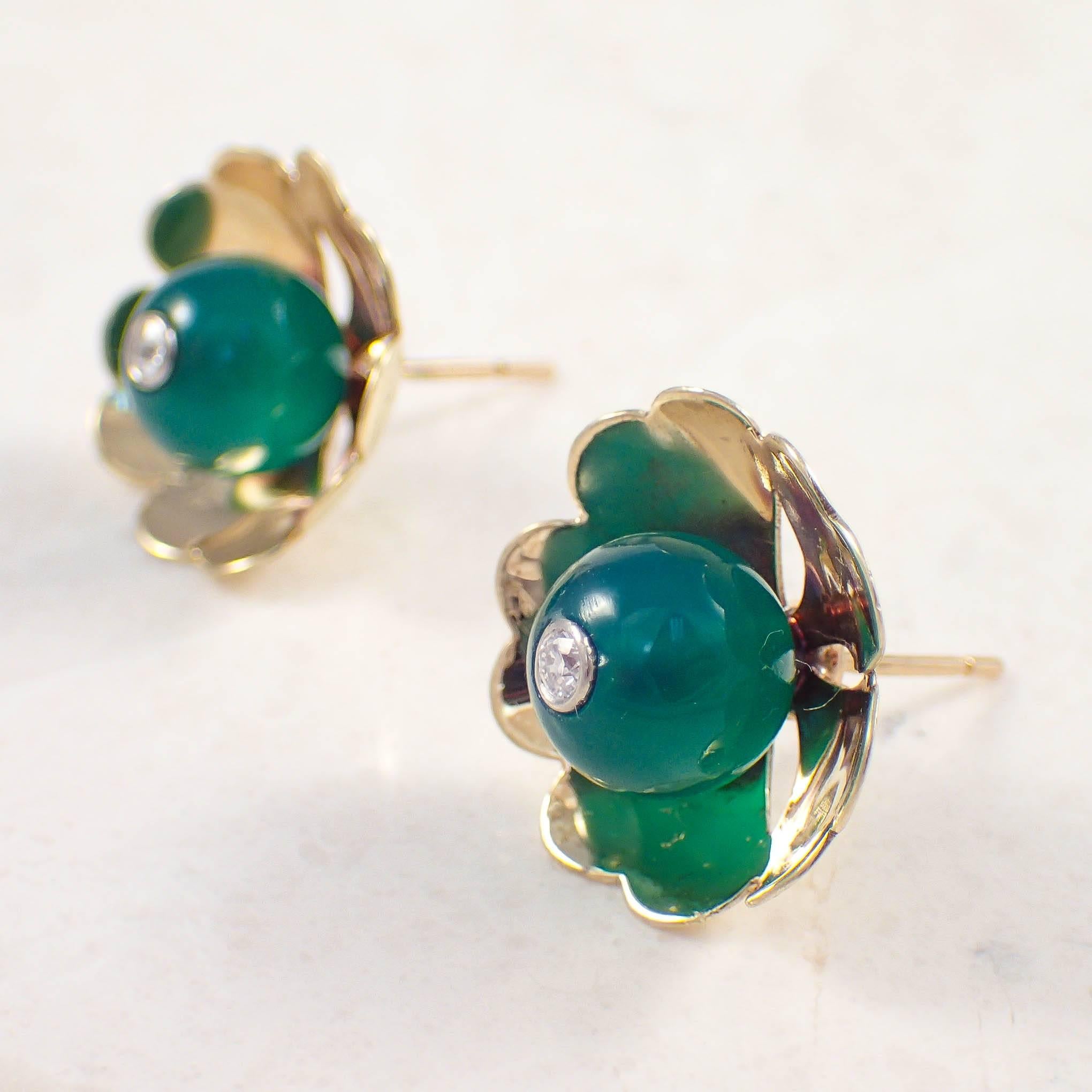 14K Yellow gold Cartier green onyx and diamond earrings. The yellow gold flower petal settings contain green onyx beads, each set with a small round diamond. The earrings measure 17.3 mm and weigh 5.2 grams. Stamped 