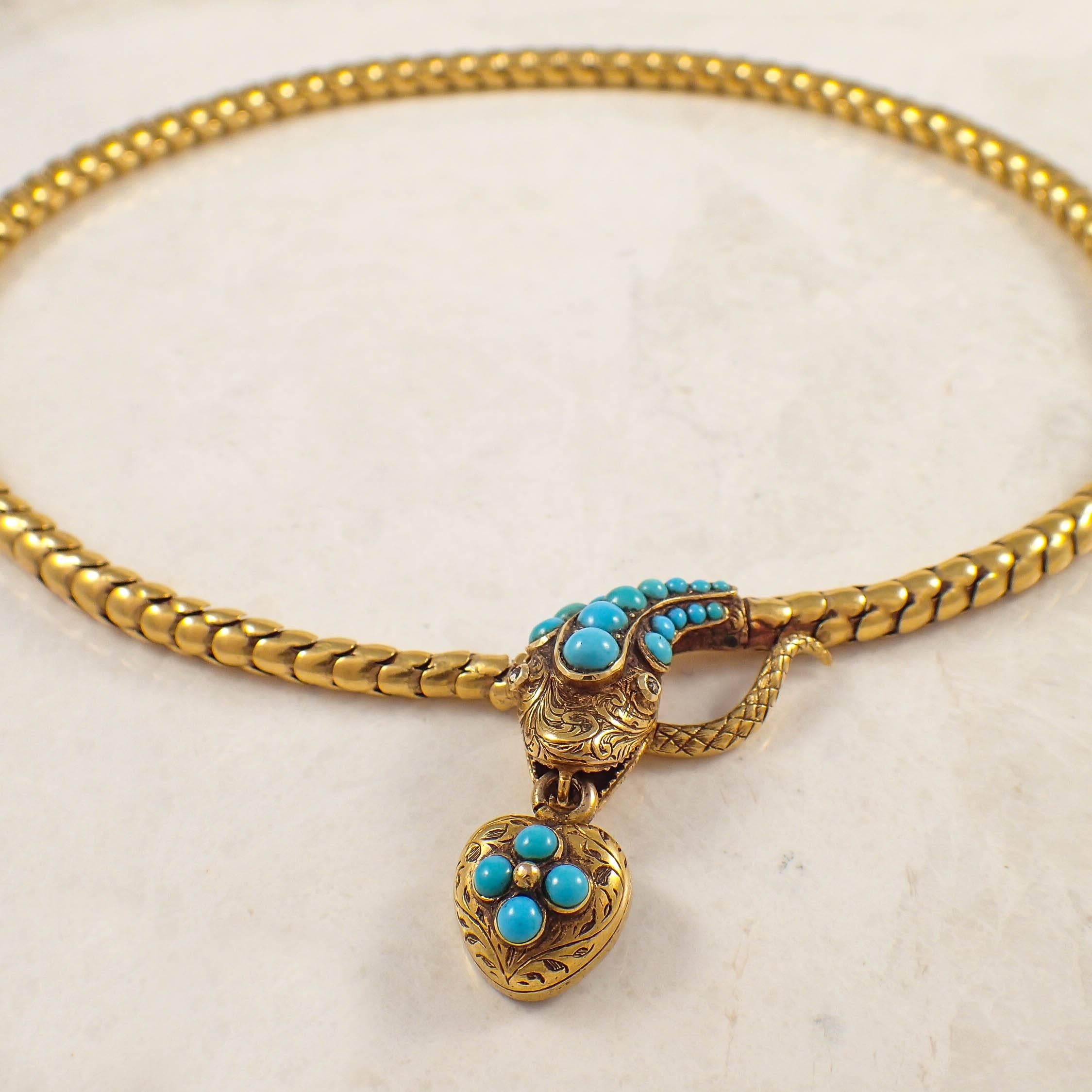 Victorian 14k yellow gold turquoise and diamond snake necklace. The graduated snake-style chain measures from 5.4 to 5.7 mm wide. The snake head front clasp features small diamond eyes, and is decorated with small cabochon cut turquoise. The