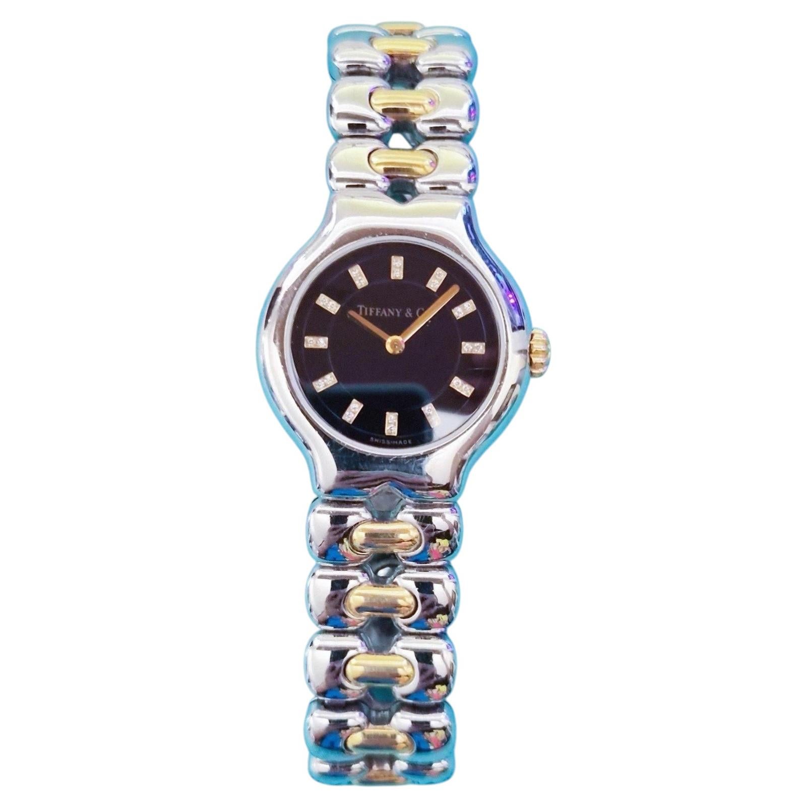 Vintage Tiffany & Co. Reloj de cuarzo Tesoro con esfera negra tipo «Diamond», de acero y oro de 18 quilates