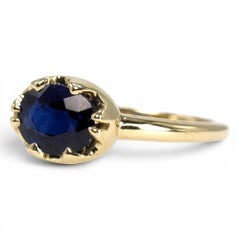 1.54 Carat Oval Blue Sapphire in East-West Belcher Inspired Gold Ring