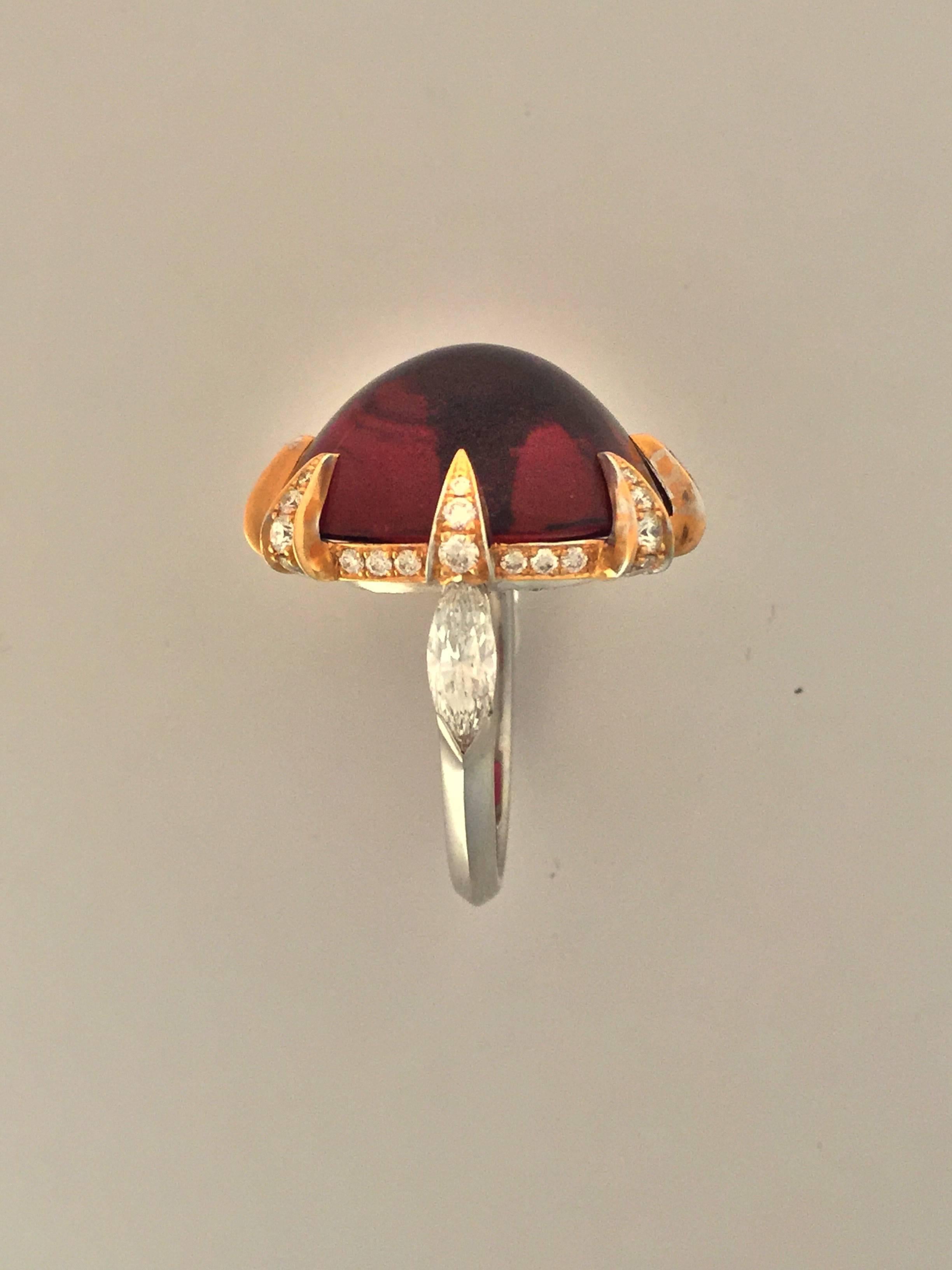 Rubelite Cabochon weighting 22,50 Carats Mounted in a 18Kt Yellow gold with 1,74 Carats of Diamonds,. Signed N.V. Milano.
N.V Milano produces all its Collection with the highest craftsmanship in its laboratory based in the very heart of Milano.