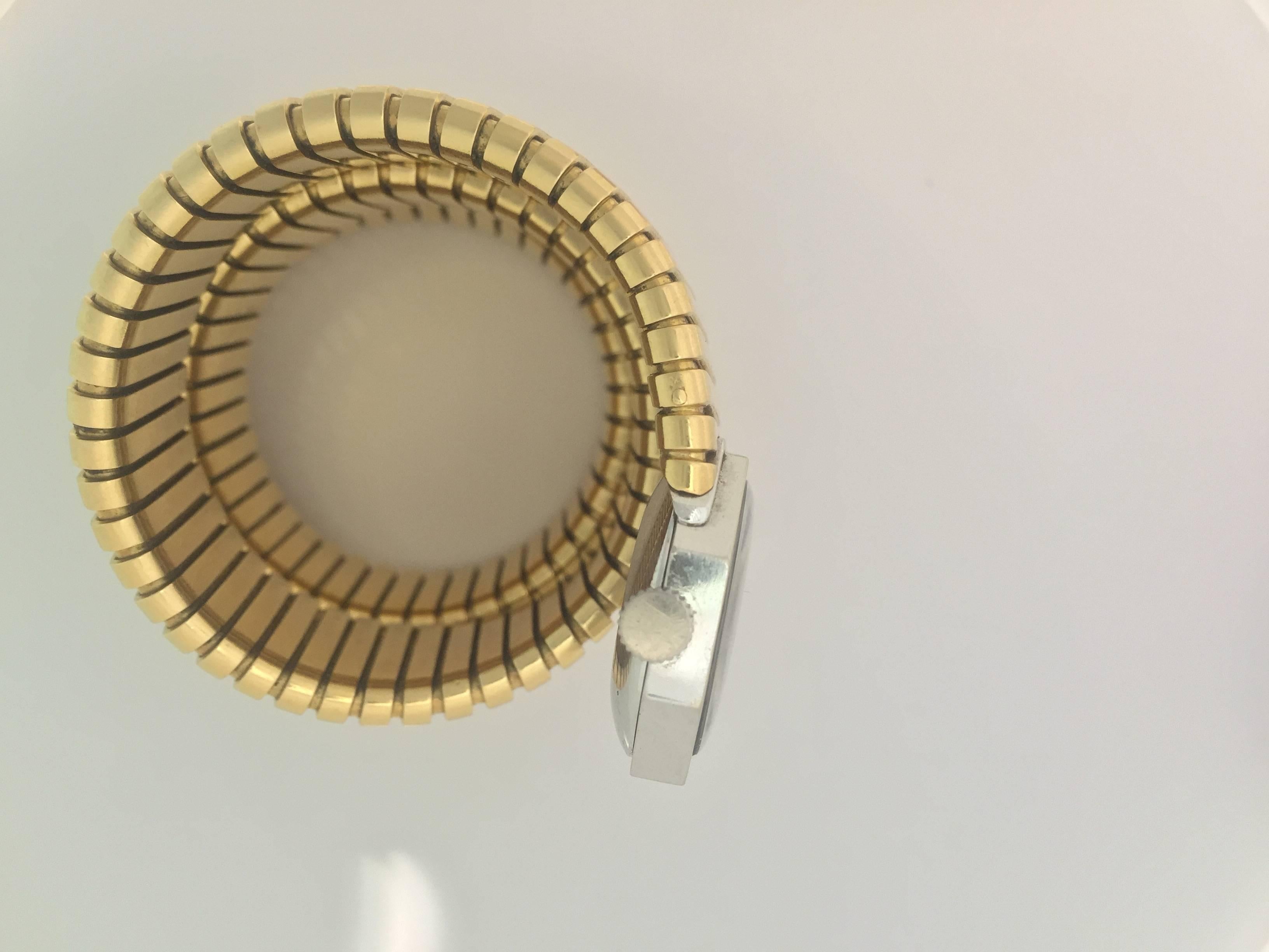 Bulgari lady's 18k yellow gold Tubogas bracelet watch, circa 1965, manual-wind  silvered dial with Roman numerals, and presenting an unusual octagonal dial mounted in 18k white gold.