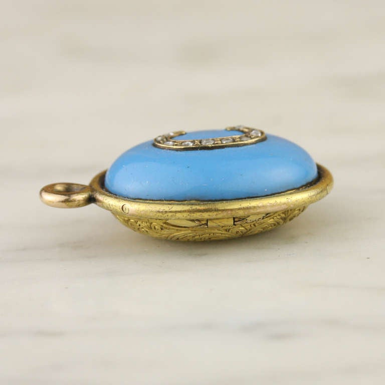- Letter C Pendant
- c. 1855
- 15k yellow gold, enamel, diamond, pearl, hair
- Made in England

This wonderful little find is a rare treasure in so many ways: the crisp modernity of its brilliantly styled monogram; the magnificence of its