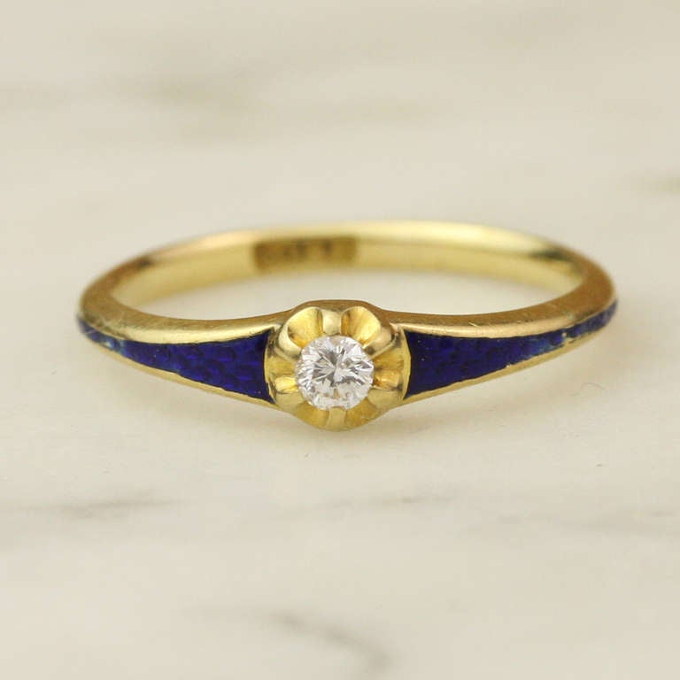 - Antique Belcher Set Diamond Ring with Blue Guilloche
- c. 1820
- 18k yellow gold, enamel, diamond
- Made in England

Striking and truly elegant, this slim ring features a pleasingly sturdy band showcasing deep, vibrant royal blue guilloche
