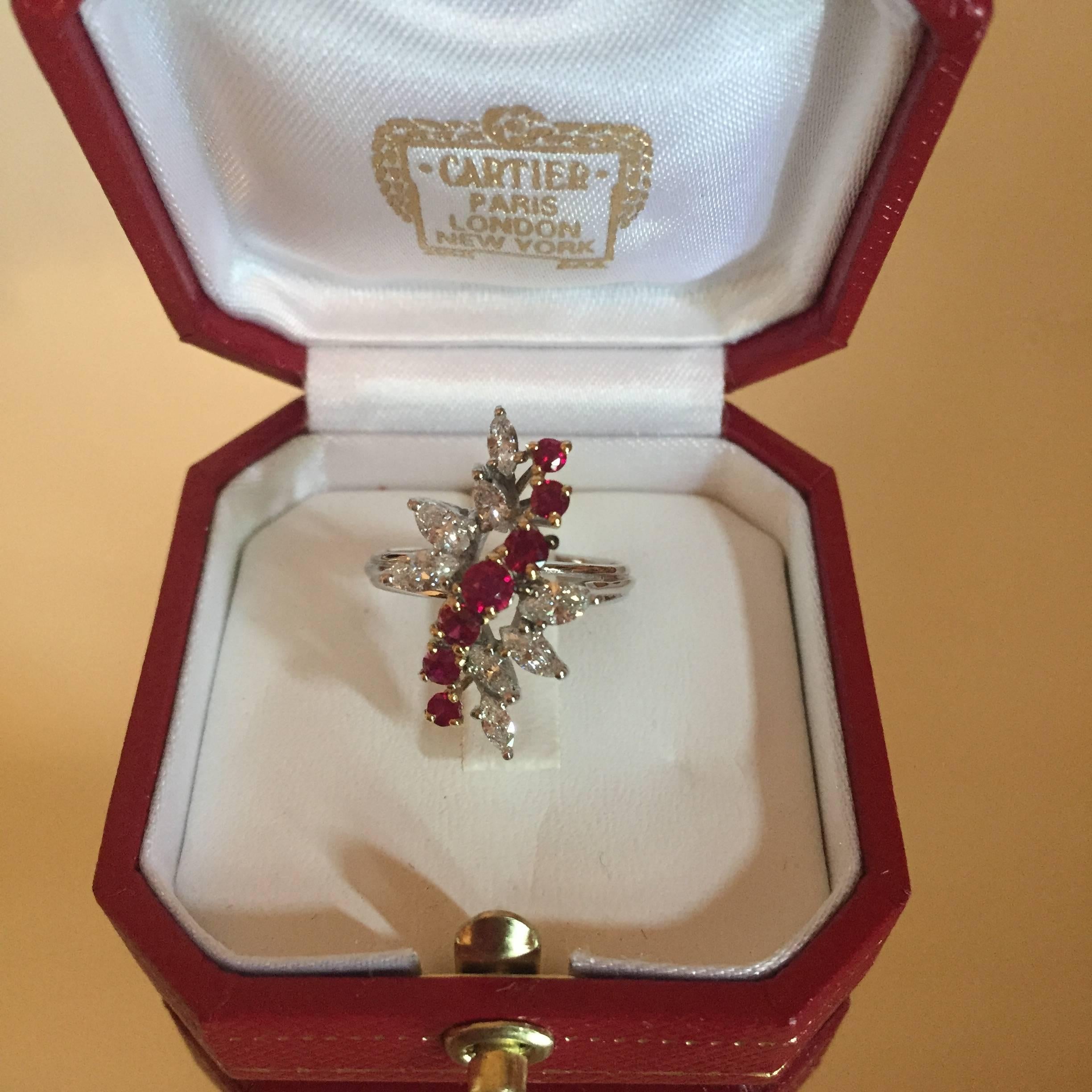 Vintage Cartier 18KT white and yellow gold diamond and ruby cocktail ring. Ring contains approximately 1.OOCTS. in diamonds and approximately .40CTS. in rubies. Diamonds are F - G in color and VVS - VS in clarity. Ring is a size 6 and it can be re