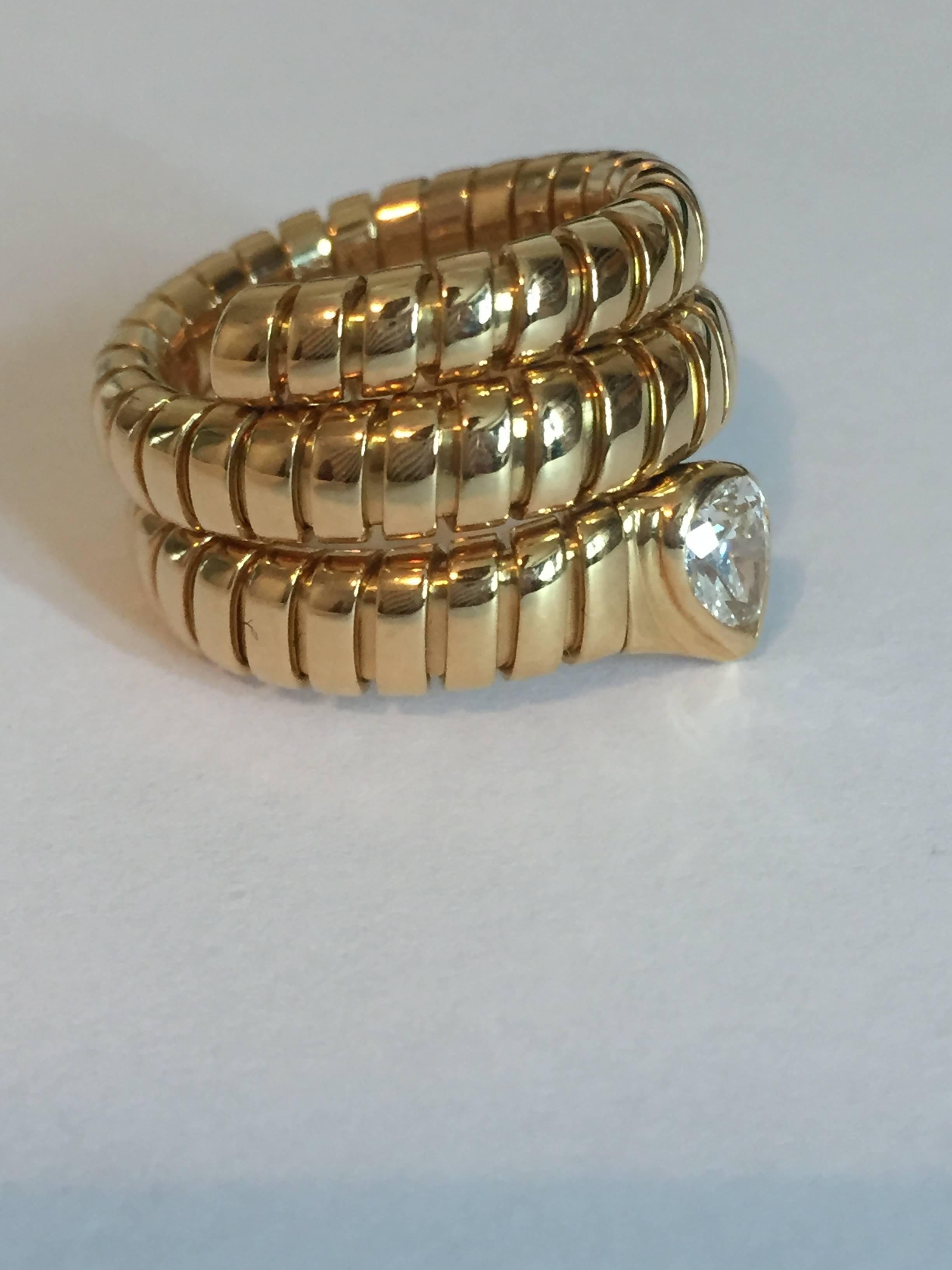 Bulgari  Bvlgari spiga snake ring. Ring is 18KT yellow gold with a  pear shaped diamond with approximately .50cts. in weight . Diamond is  F in color and VS in clarity. Ring weighs 14.80 grams and it is a size 6 1/2. Ring is adjustable so the size
