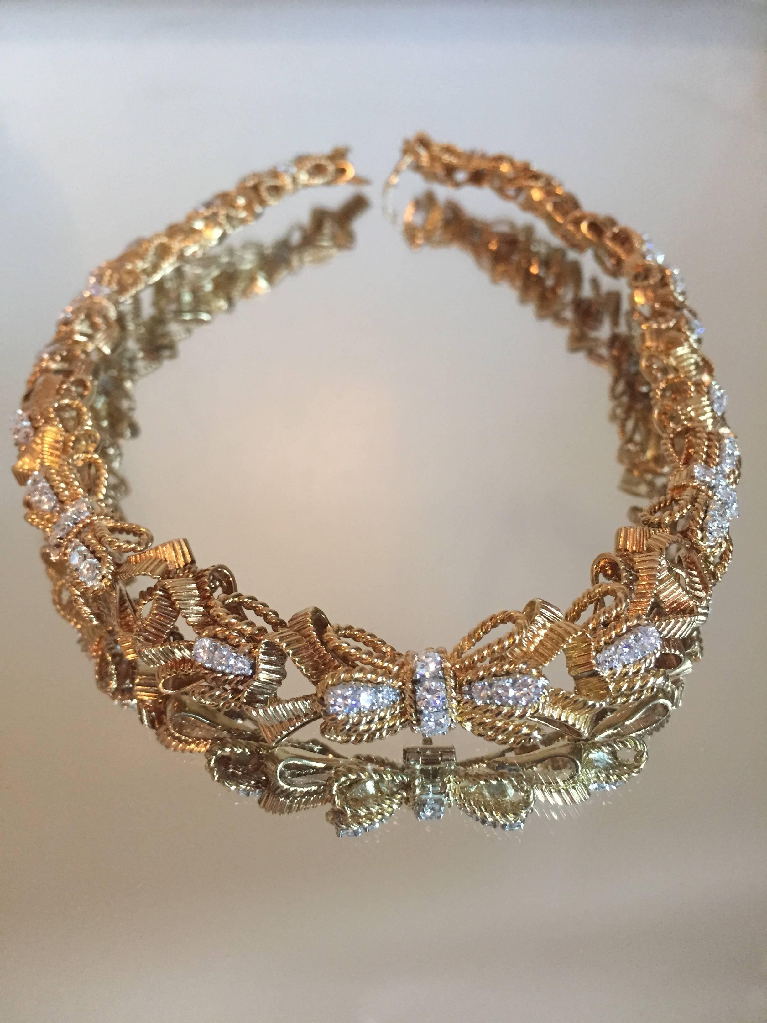 Vintage Tiffany & Co. Schlumberger 18KT yellow gold diamond bow necklace. Necklace contains approximately  3.00CTS. in diamonds. Diamonds are E - F in color and VVS - VS in clarity. Necklace weighs 112.00 grams. Necklace is 16 inches in length and