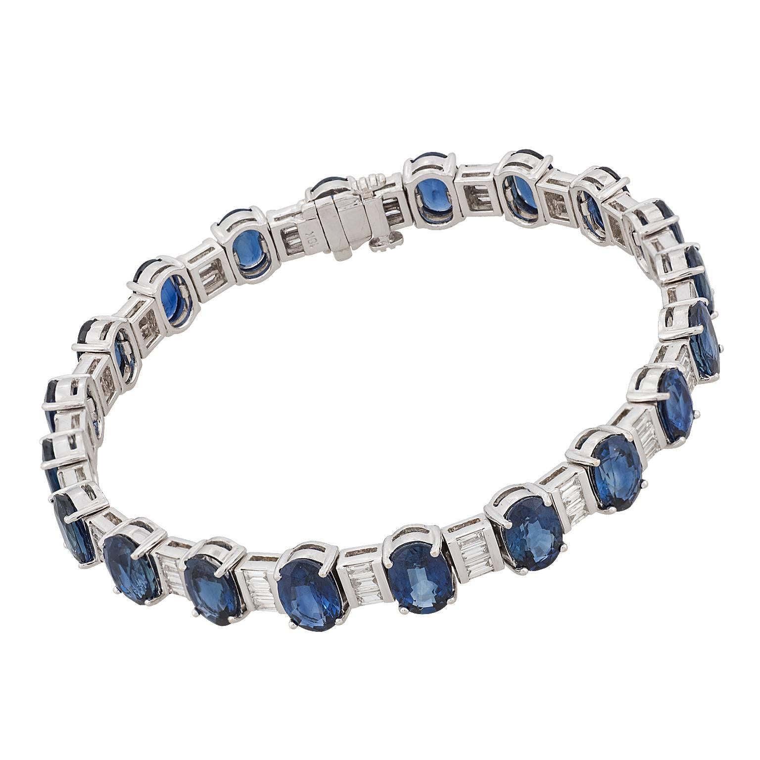 20.00 carat oval sapphire and baguette diamond 18 karat white gold bracelet.  The bracelet is designed in an alternating pattern of one oval sapphire between three baguette diamonds.  The 60 diamonds have a total weight of 2.50 carats.

Hallmark: 