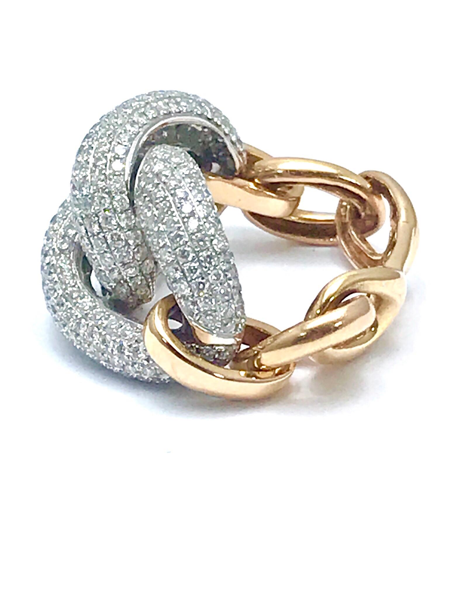 This is a gorgeous fashion ring.  The ring contains 2.35 carats in round brilliant pave Diamonds, set in interlocking links in 18 karat white gold, with 18 karat rose gold flexible links for the shank.  The Diamonds in the ring are graded as G-H