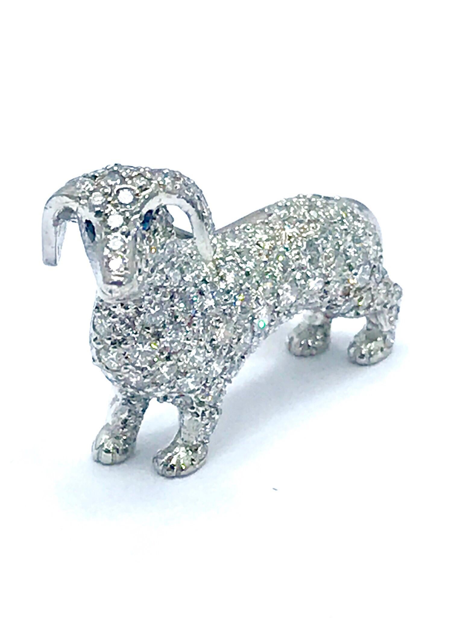 This is an adorable Dachshund Diamond brooch, containing 2.30 carats in round brilliant Diamonds set in 18 karat white gold.   The diamonds are graded as F-G color, VS clarity.  The brooch displays great quality craftsmanship and attention to