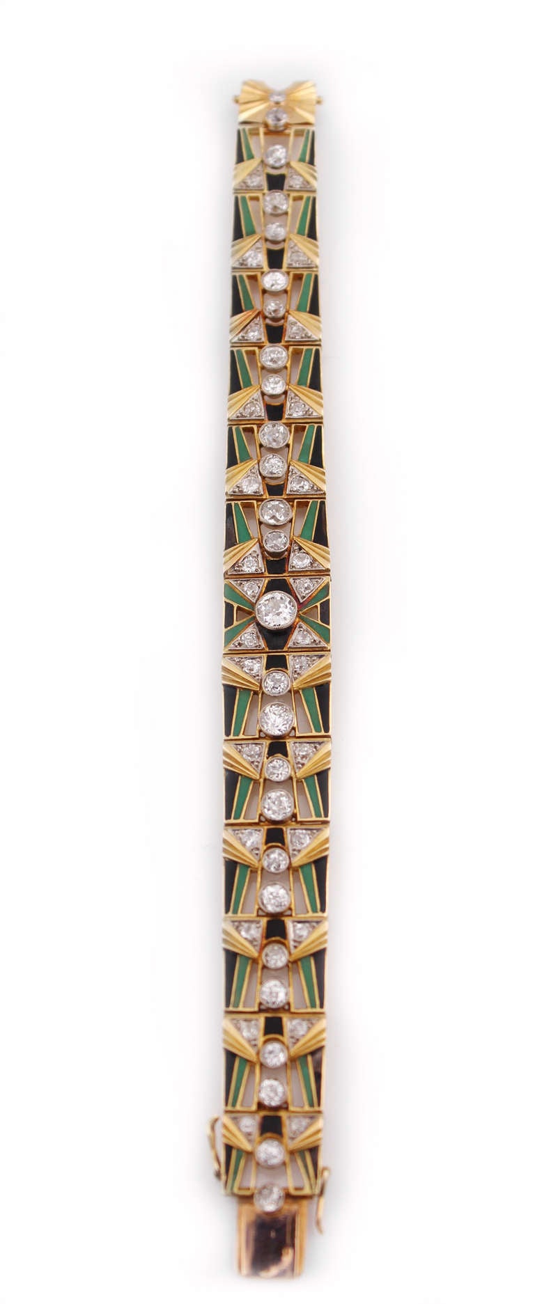 A beautiful diamond and enamel Art Deco bracelet.  There is an estimated total weight of 5.00cts  of old European cut diamonds, with black and green enamel in 18K yellow gold.  The bracelet measures 6.5 inches in length.