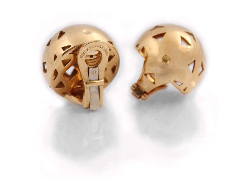 Simple, classic, wearable day and night earrings by Bulgari.  A dome design with triangular cut outs, and clip backs in 18k yellow gold.

Signed: 