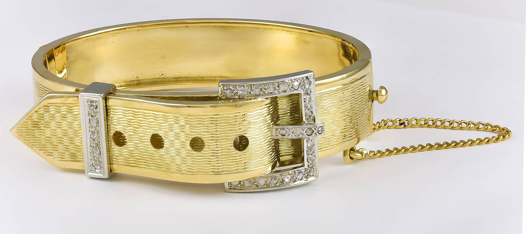 A wonderful rose cut diamond 15K yellow and white gold buckle bangle bracelet.  The 28 diamonds are prong set weighing .75cts total.

Hallmark:  15K
Size:  7.00 inch wrist  