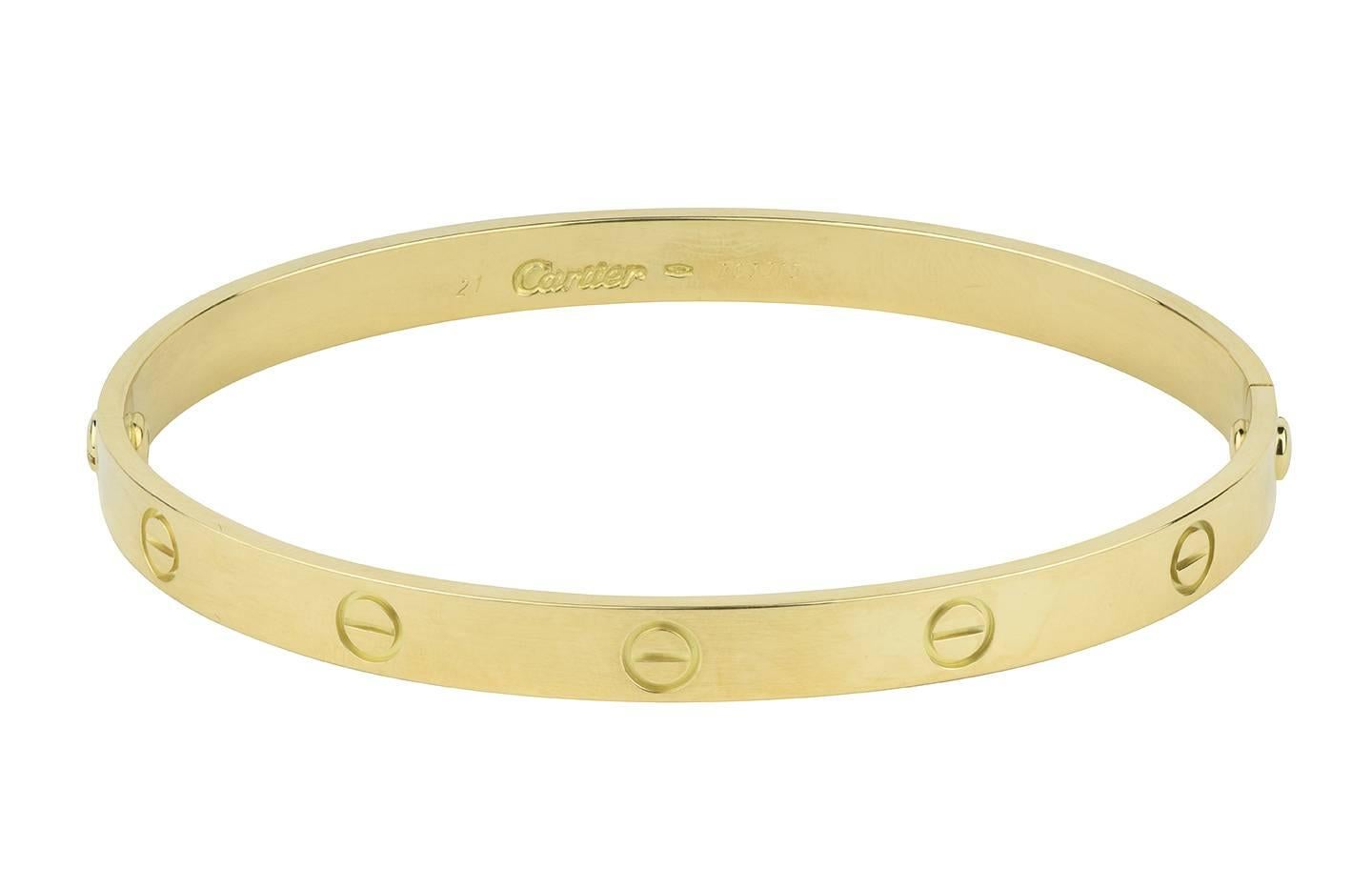 The iconic Cartier Love bracelet in 18k yellow gold.

Hallmark:  750
Serial:  763315
*7 1/2 inches
(screwdriver not included)
