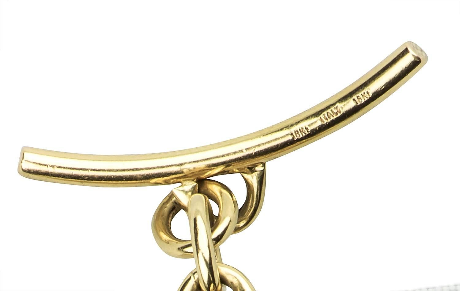 A great retro 18k yellow gold wide bracelet.  The links are large twisted ovals connected by small ovals, with a toggle clasp.

Hallmark:  750  Italy
Length:  8.00 inches