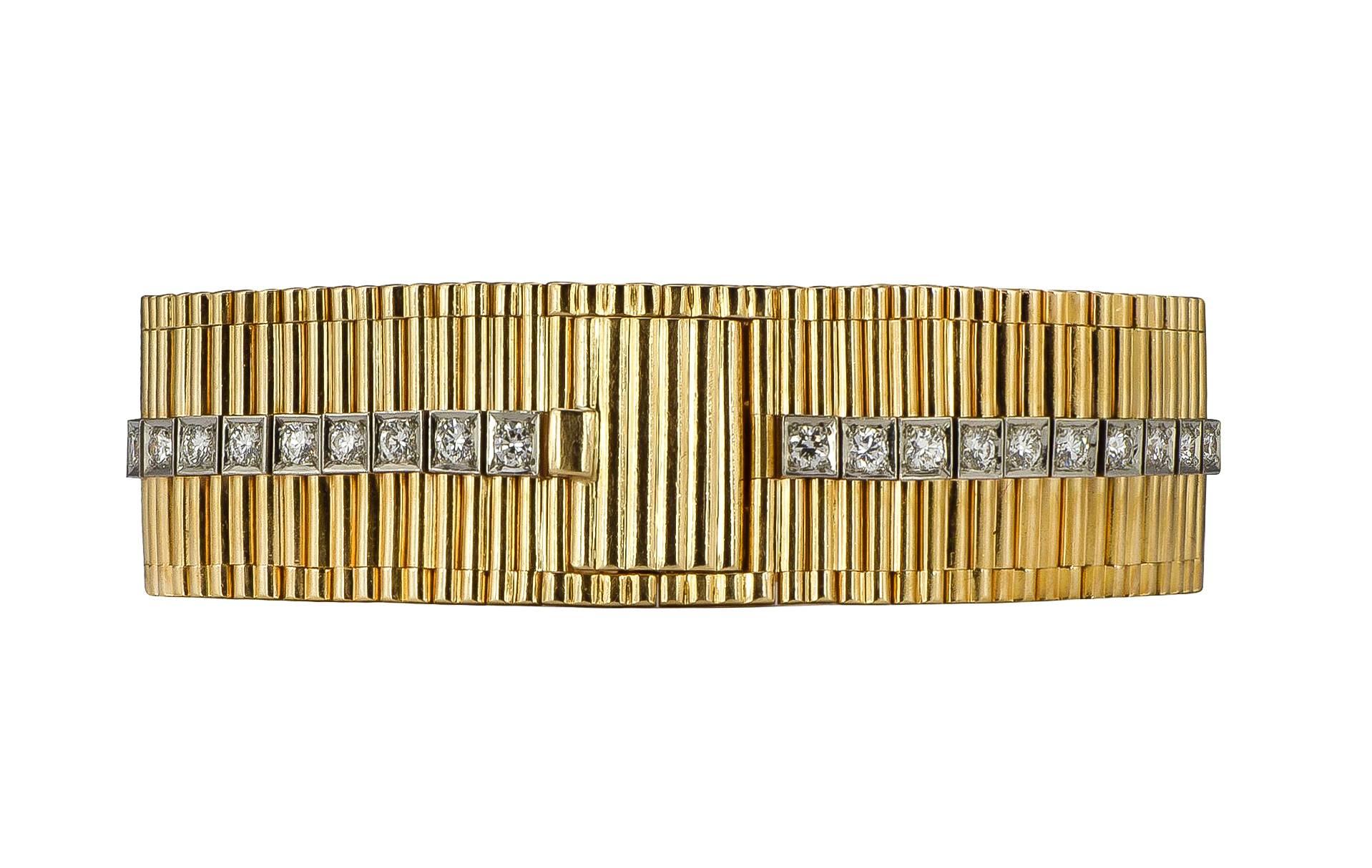 A fabulous retro diamond and 14k yellow and white gold box set line and rollo link bracelet, designed by Cartier.  There are 47 round brilliant diamonds, with a total weight of 2.35cts, graded as F-G color, VS clarity.  

Signed:  Cartier