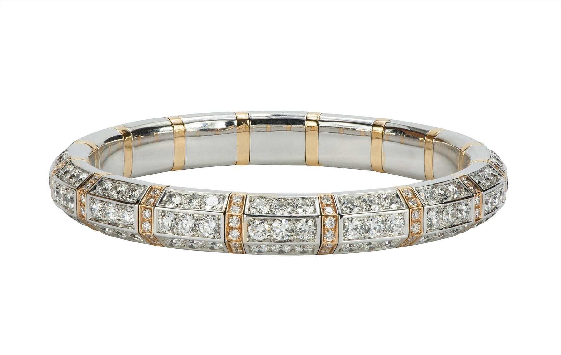 An absolutely stunning 13.30ct expandable tennis bracelet in 18kt white and pink gold by Picchiotti fine jewelers. The round brilliant diamonds are F-G color, VS clarity. The bracelet is made to stretch to slide over the hand and on to the wrist,