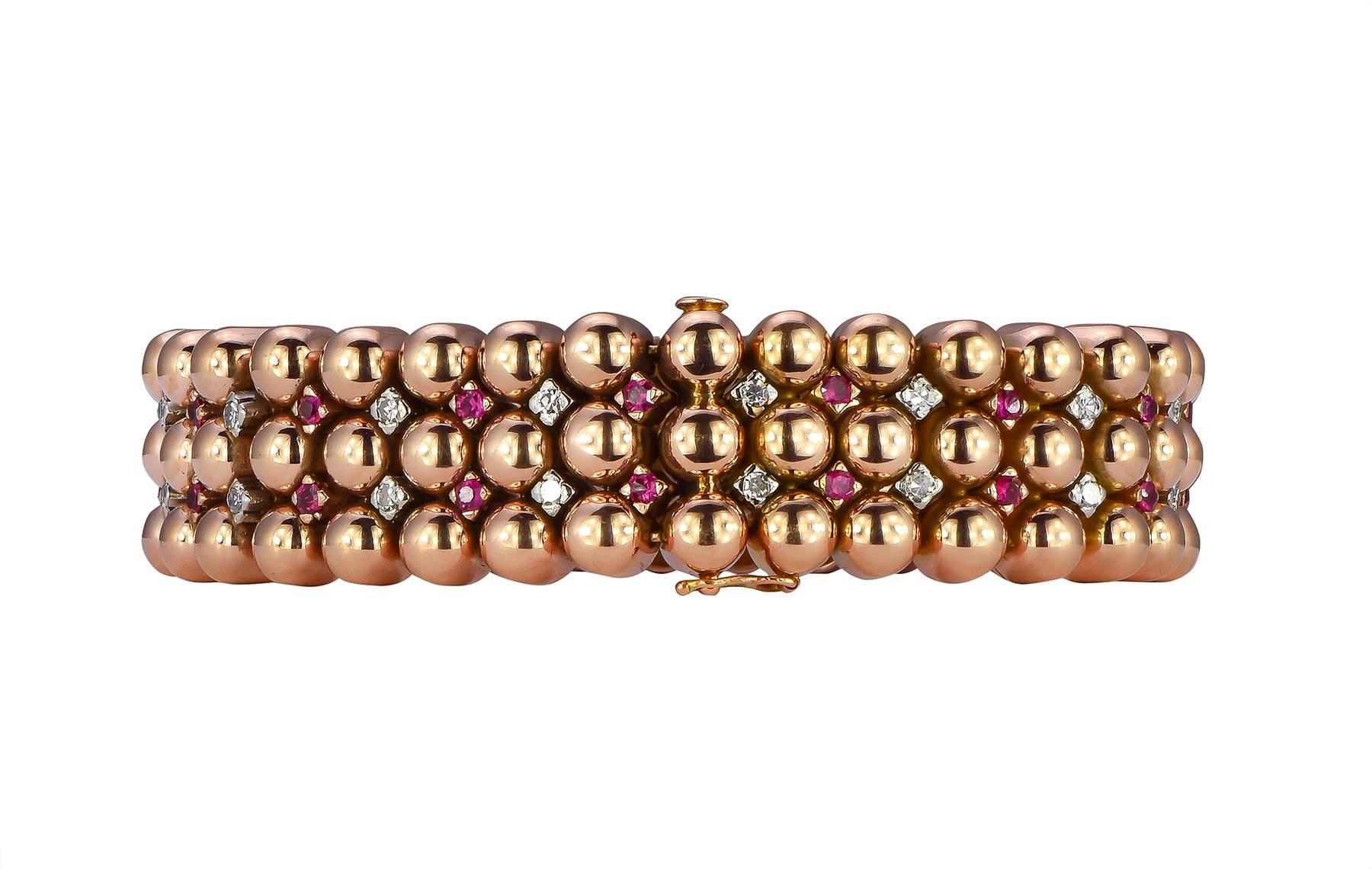 Retro ruby and diamond bracelet in 18k rose gold with slide pin closure.  The 32 single cut diamonds have a total weight of 1.46cts, with the 32 rubies having a weight of 1.66cts.  The diamonds and rubies rotate every other, and are set between the