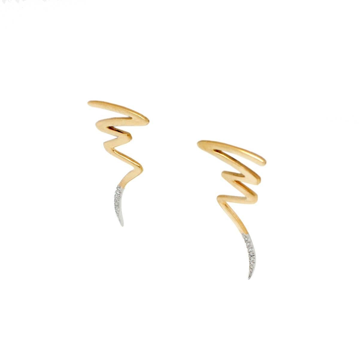 Paloma Picasso agreed to produce jewelry in France for Tiffany & Co. after an already very successful career in minimalist expression contemporary jewelry. These miniature lightning bolts are absolutely gorgeous set in 18k yellow gold and containing