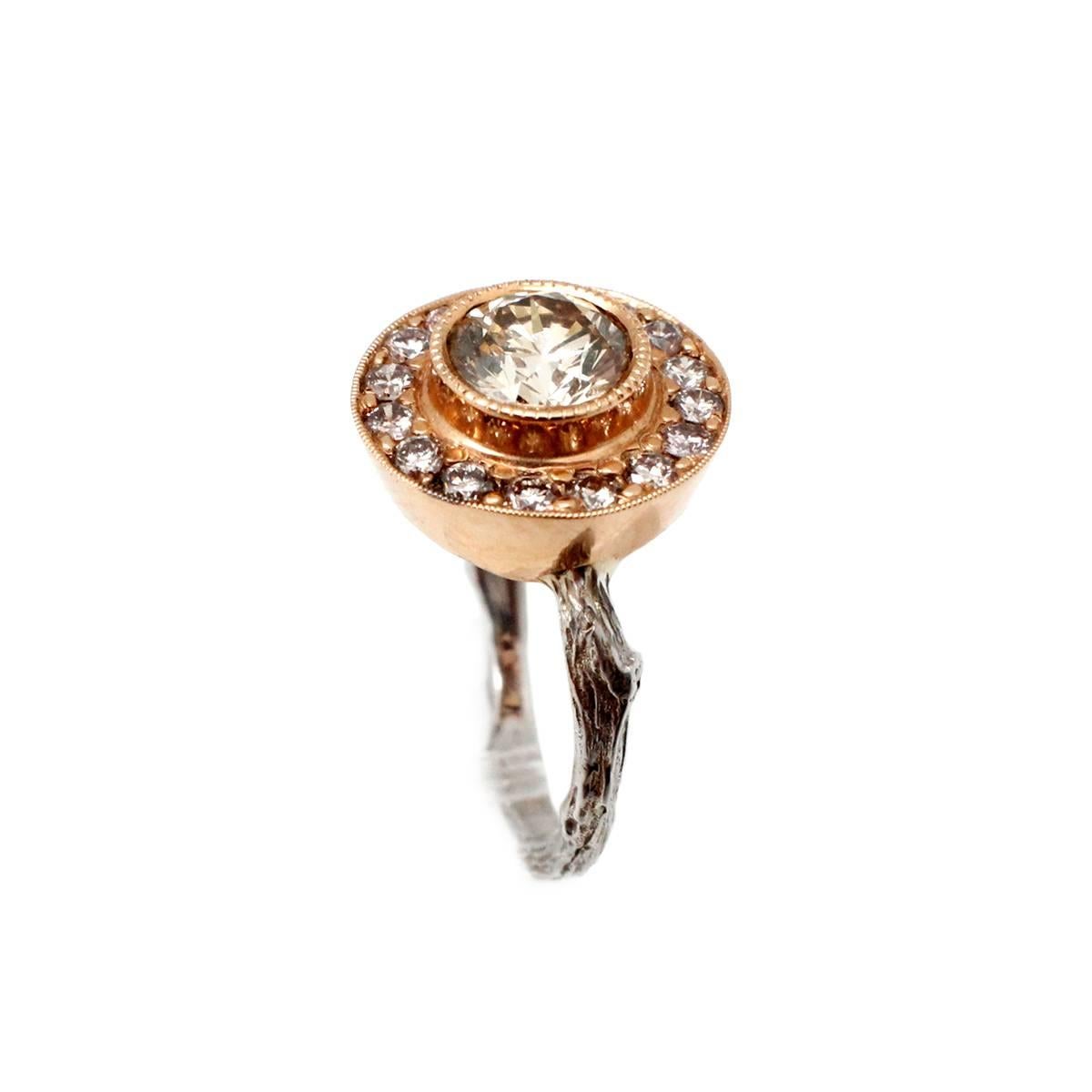 K. Brunini 18k White/Rose Gold Diamond Halo Twig Ring Size 6
This gorgeous ring is made in 18k white and rose gold by K. Brunini for the Twig collection. The center diamond weighs approximately 1.10 carats, and it is graded champagne in color and