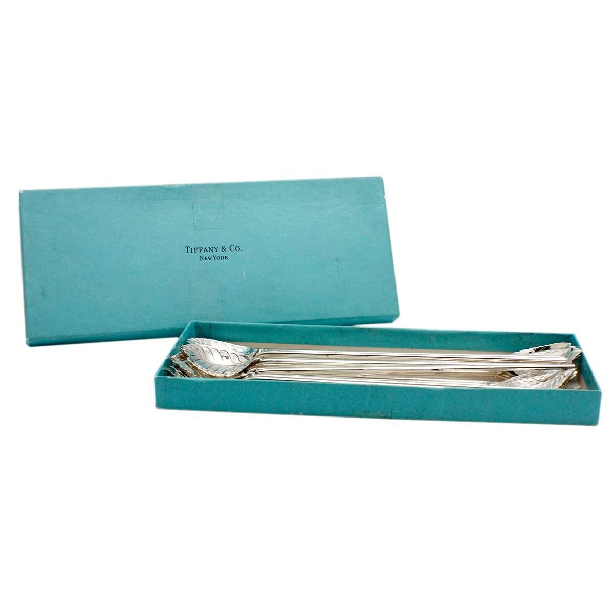 This stunning set of 17 signed Tiffany and Company mint julep spoons are sure to accentuate any afternoon tea or evening mojito. Each piece is composed of sterling silver and has the artistically designed mint leaf on the end. The handles are hollow