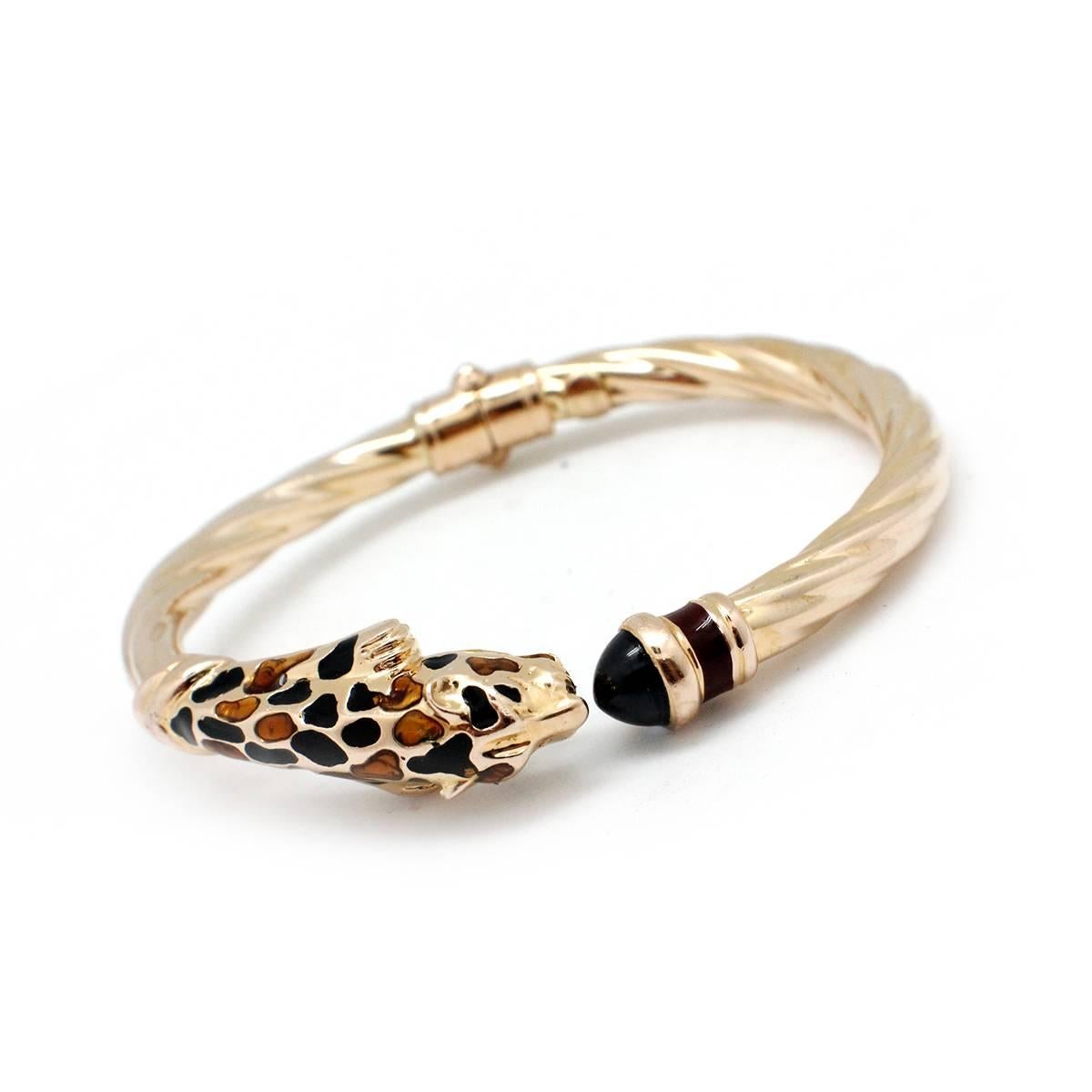 This  exotic and beautiful panther bracelet is one of Faro’s  artistic genius designs.  This is a piece to be worn by itself as a whisper of exoticness or to layer with others to capture its mystique.  Crafted in enamel,  and 14k yellow gold, a