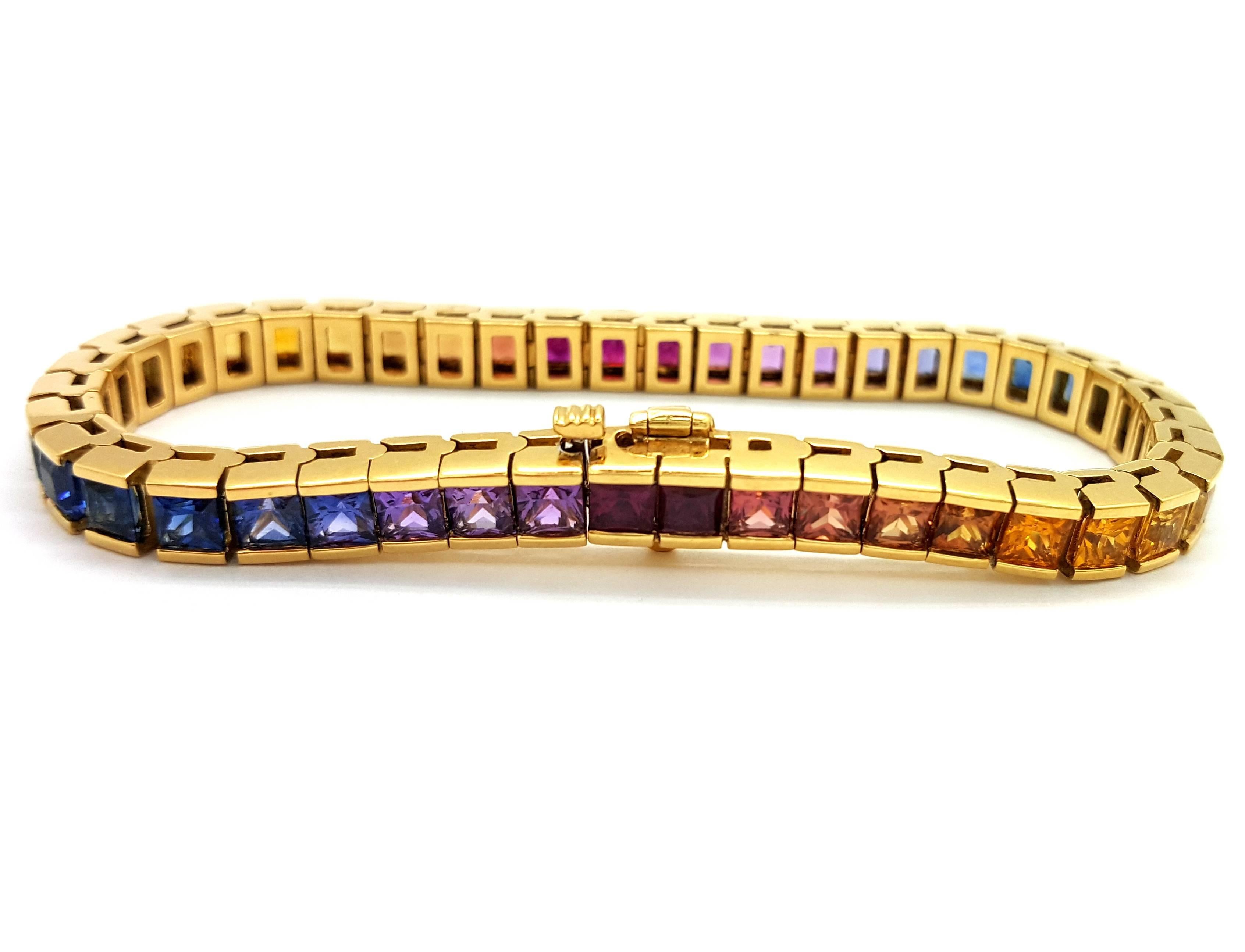 Discover the beauty and effervescence of the rainbow in this matched selection of vibrant sapphires. Custom designed and hand crafted by a master jeweler, this bracelet portrays 15.73 carats of rainbow sapphires set in a stunning 18k yellow gold