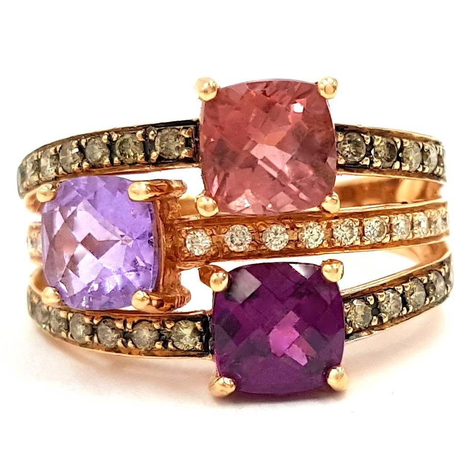 Signed LeVian 14kt Rose Gold featuring three triangularly placed 1 carat amethysts in the ring. These amethysts totaling 3.00 Carats of Natural No Treatment, Amethyst are colored as followed strong pink 1 carat amethyst, next to intense violet 1