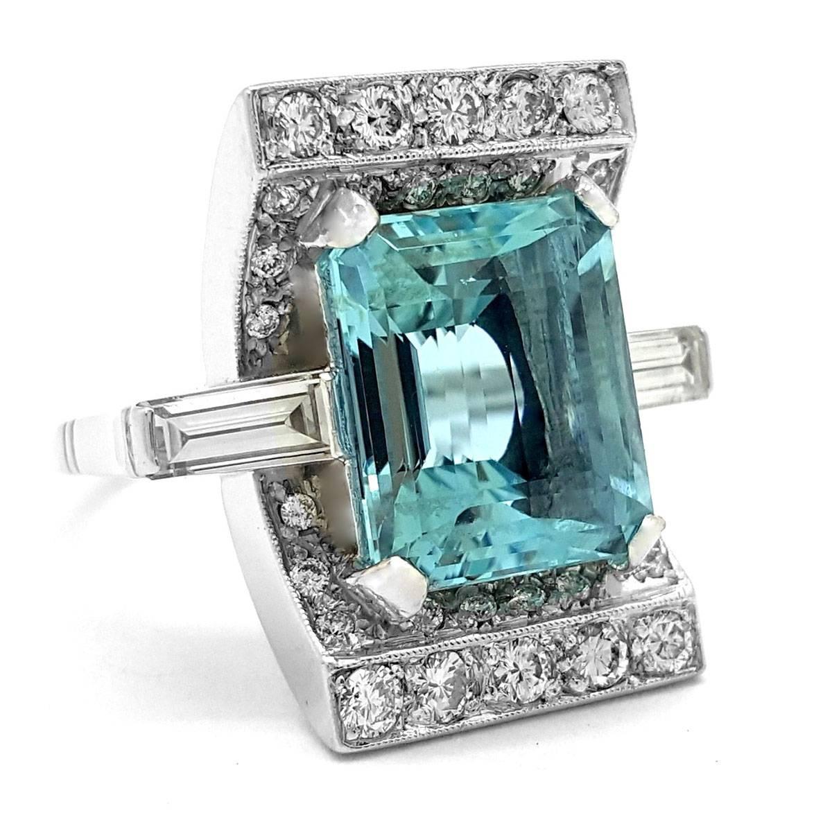 This cocktail ring will blow all others out of the water. Crafted in platinum, this ring holds an emerald-cut aquamarine weighing a whopping 9.54 carats! Its pale blue color is accented by sparkling round diamonds for an additional weight of 1.18