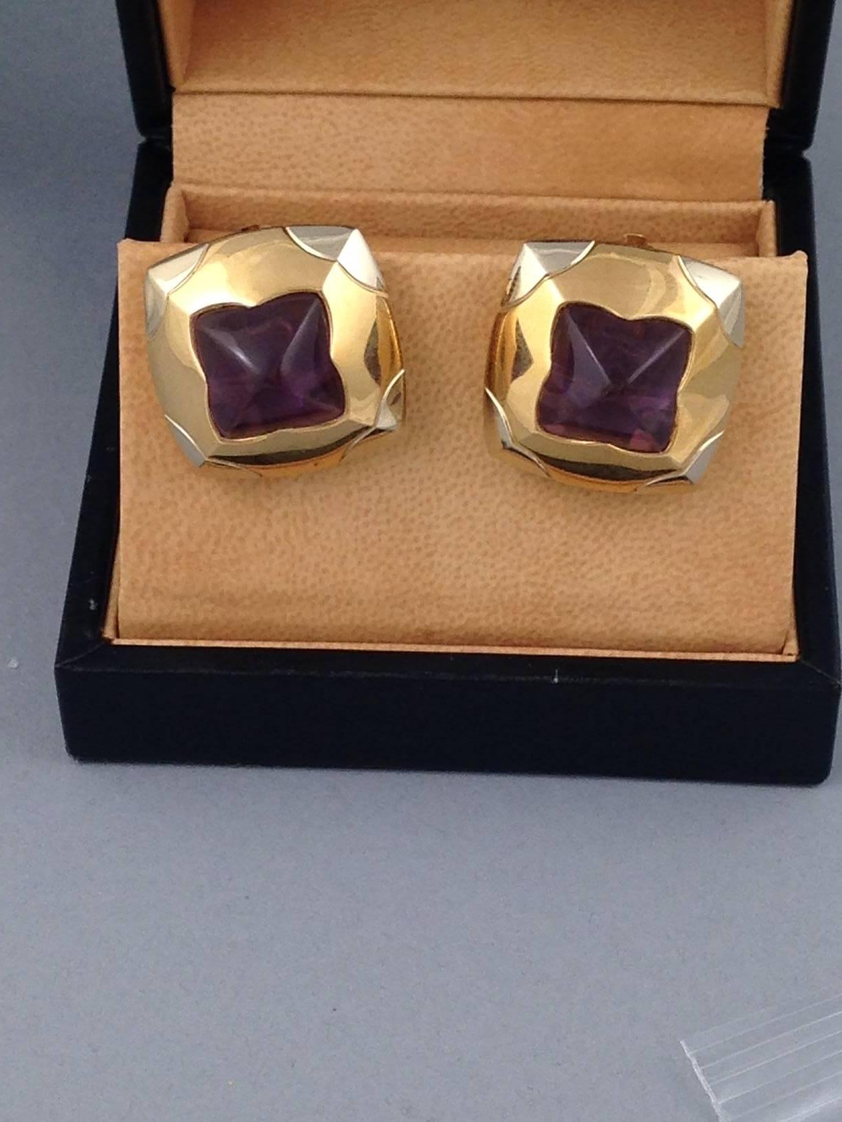 18K Yellow and White gold Bvlgari pyramid earrings with amethyst and clip-on closures.
Note: This item has been appraised and inspected by our certified graduate gemologists. All diamond and gemstone grading is done under GIA standards as the