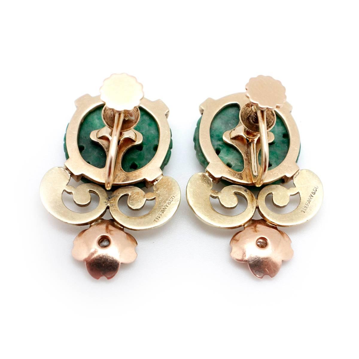 These Extremely Rare Vintage Signed Tiffany & Co. Retro 1935-1950's Hand Carved Natural Jade and Diamond Earrings have approximately .12 carats of VS clarity F color Diamonds and weigh approximately 13 grams. Are approximately 1.5 inches in height