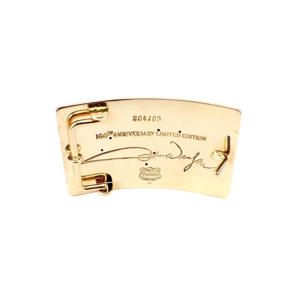 This extremely rare belt buckle by Edward H. Bohlin celebrates the 100th anniversary of the release of the film Red River featuring John Wayne. In the film, Wayne’s cattle brand is a D.
 
This buckle is made in solid 14k yellow gold, and the back