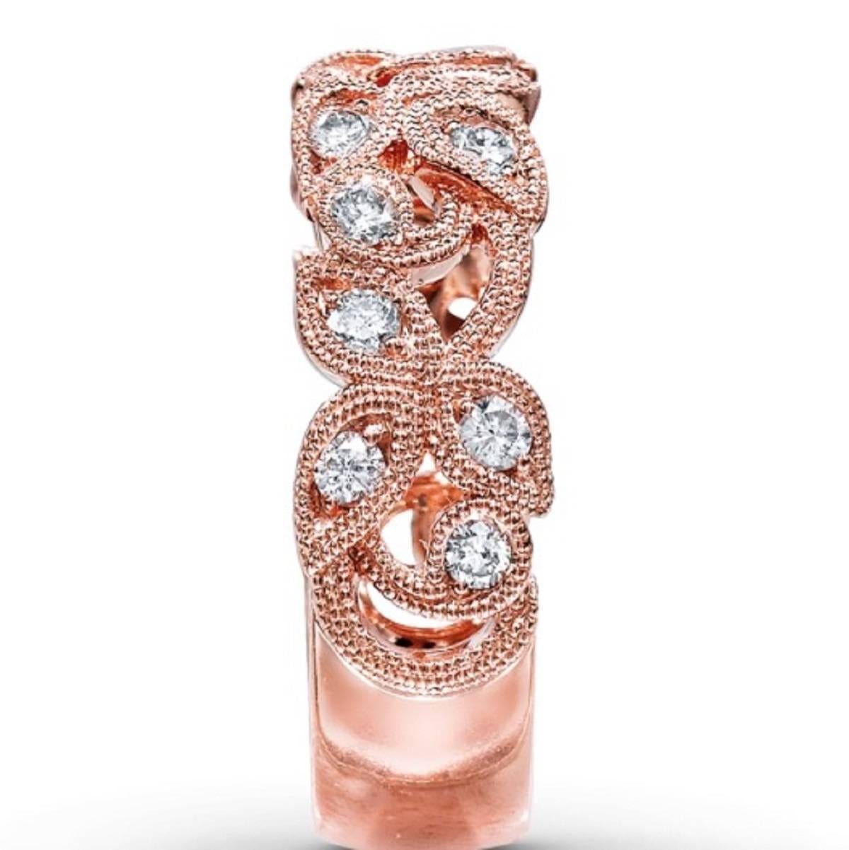 Designs by Neil Lane evoke the splendor of the past with an eye toward the future. In this vintage-inspired diamond ring for her, dazzling round diamonds decorate intricate leaves and vines of 14K rose gold. The ring, from the Neil Lane Designs®