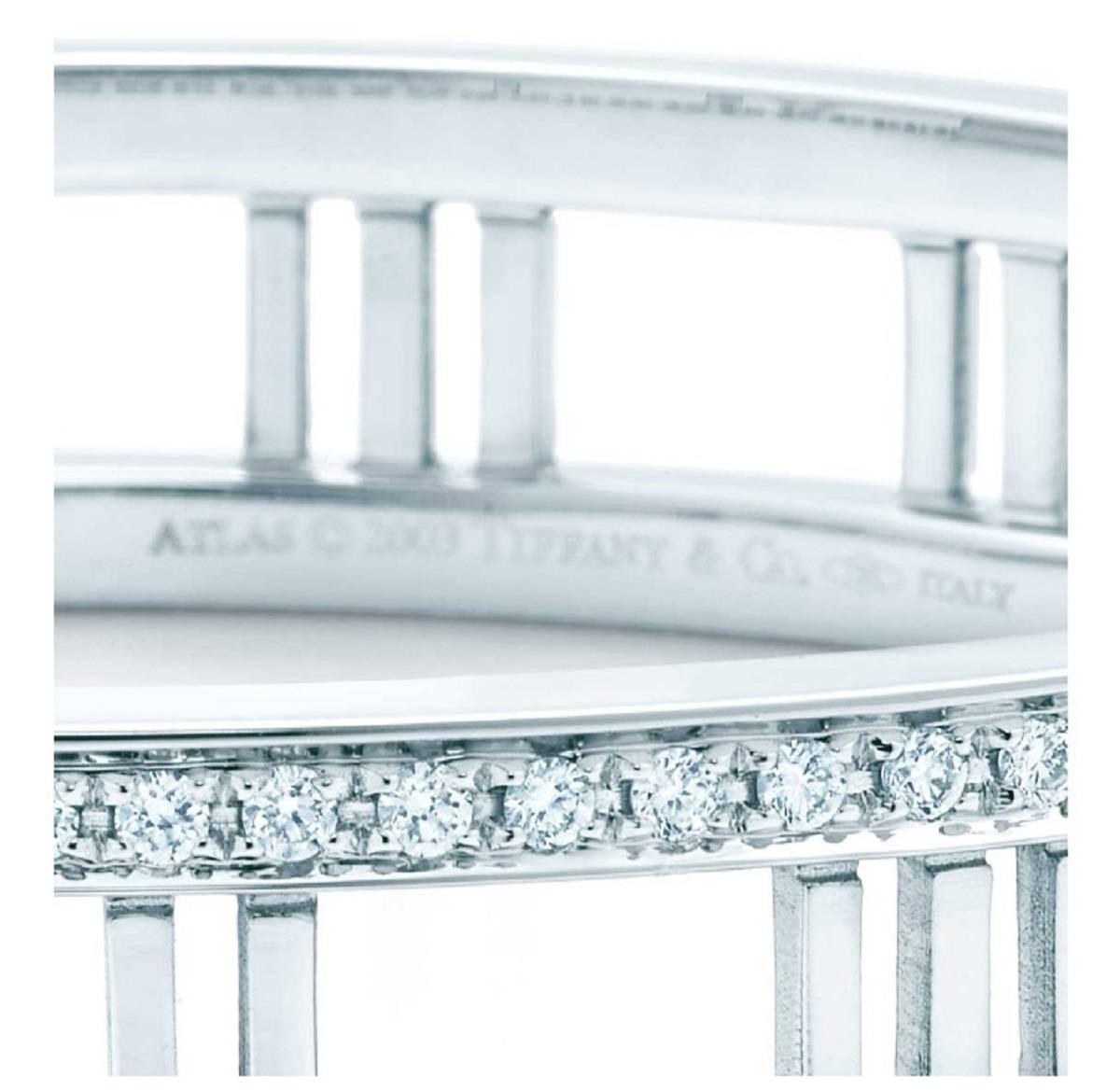 Signed Tiffany & Co. ATLAS Collection Open Hinged Bangle Bracelet
Streamlined and modern, the Atlas collection shines with graphic sophistication and bold simplicity. Dazzling diamonds complement the strong lines of this bangle's numeral