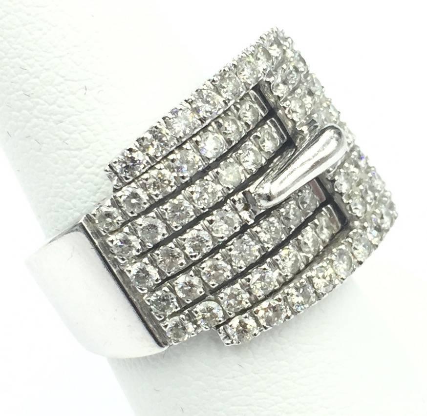 This fabulous 14kt white gold and 1.75 carats of SI clarity and H color pave set diamond buckle ring is yet another magnificent creation brought to us from modern contemporary jewelry designer Michael Christoff. Michael Christoff focuses on