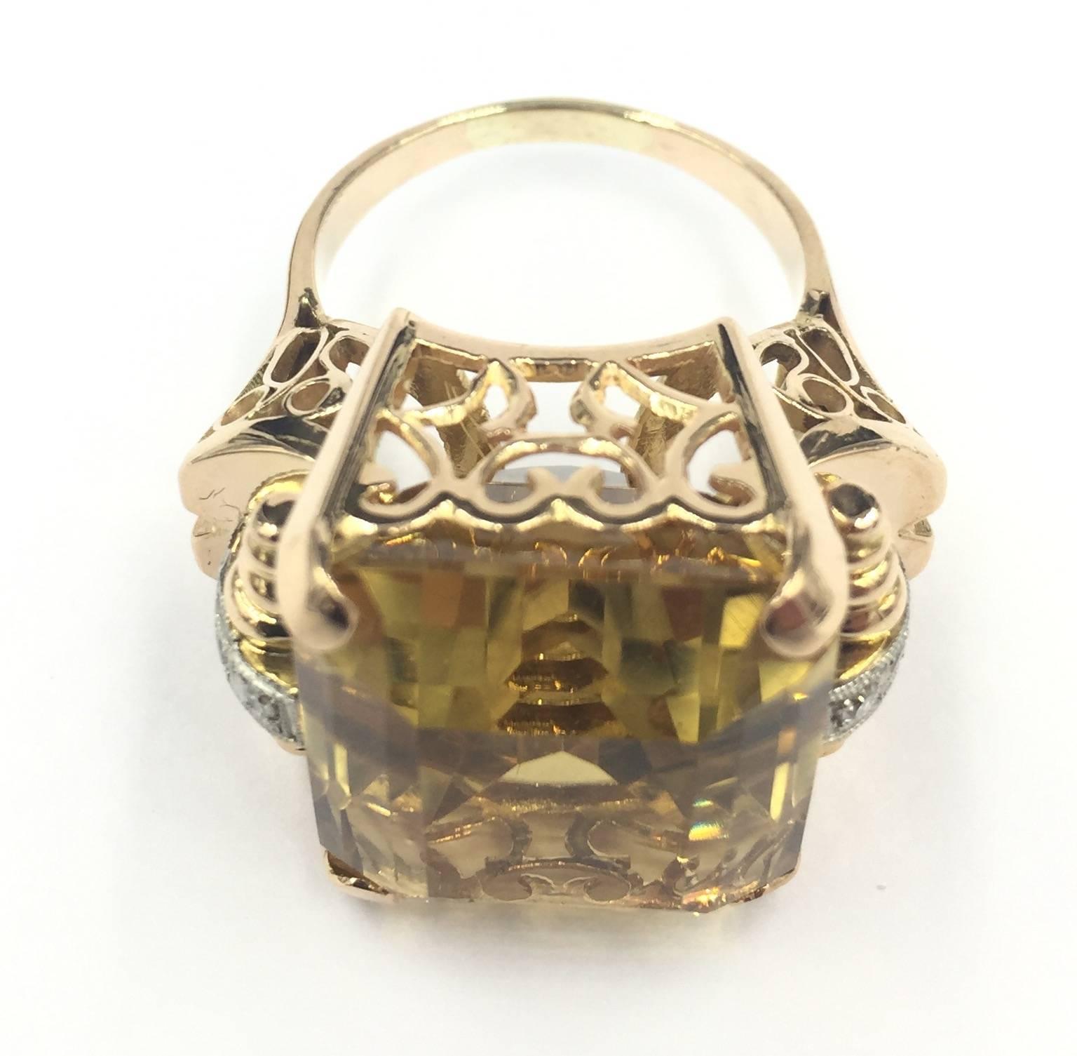 1940's Retro 14kt 22ctw Citrine and .10ctw Diamond Ring 16.7grams

The retro jewelry period lasting from 1935 until 1950 was set against war and economic depression. Nevertheless America's talented handcrafting jewelers produced some of the most