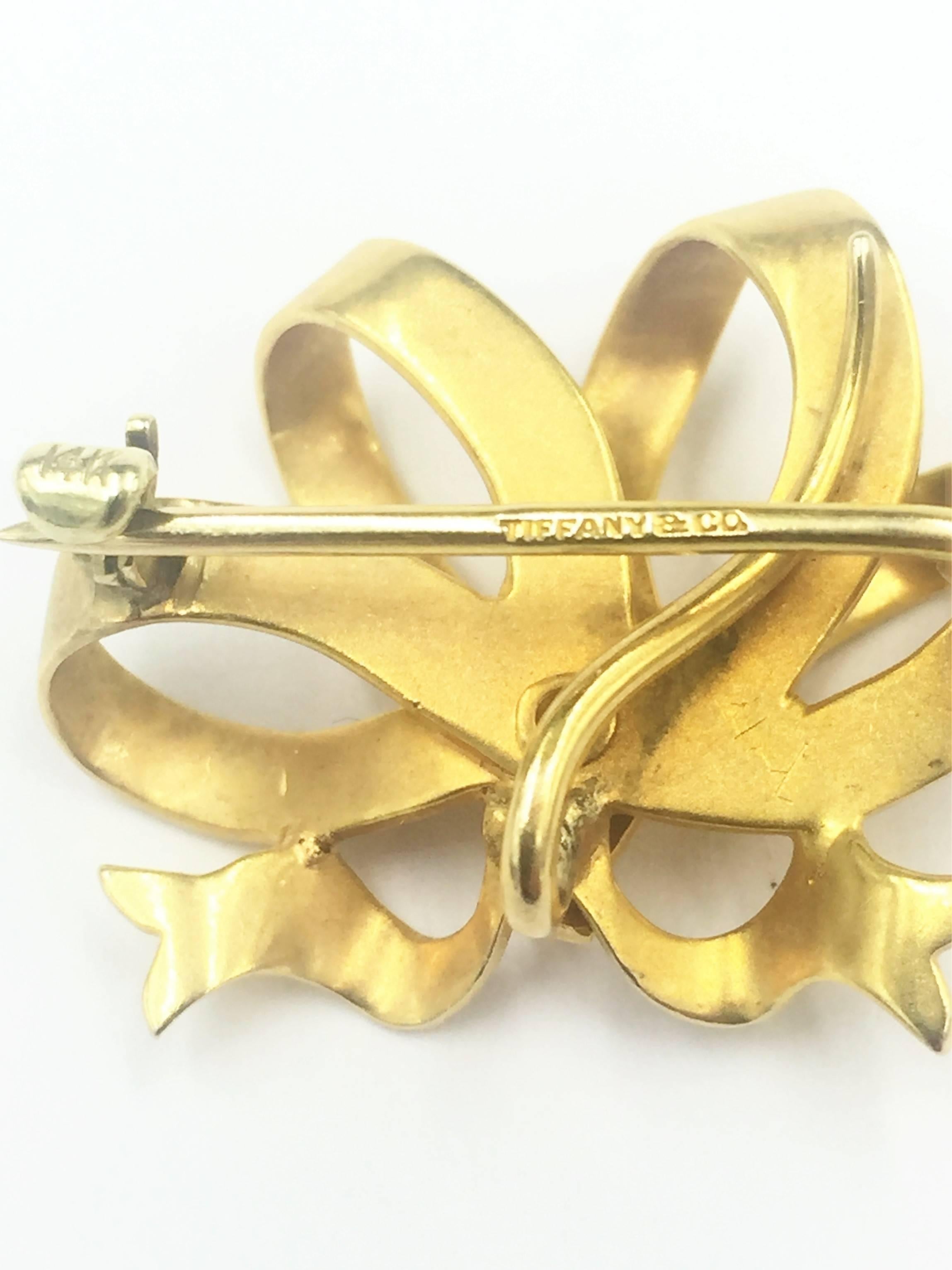 This absolutely adorable Tiffany & Co. signed bow pin, brooch, and pendant is the perfect affordable purchase for the customer that desires Tiffany & Co. quality with simplicity and contemporary design. This piece is too cute and would make a great